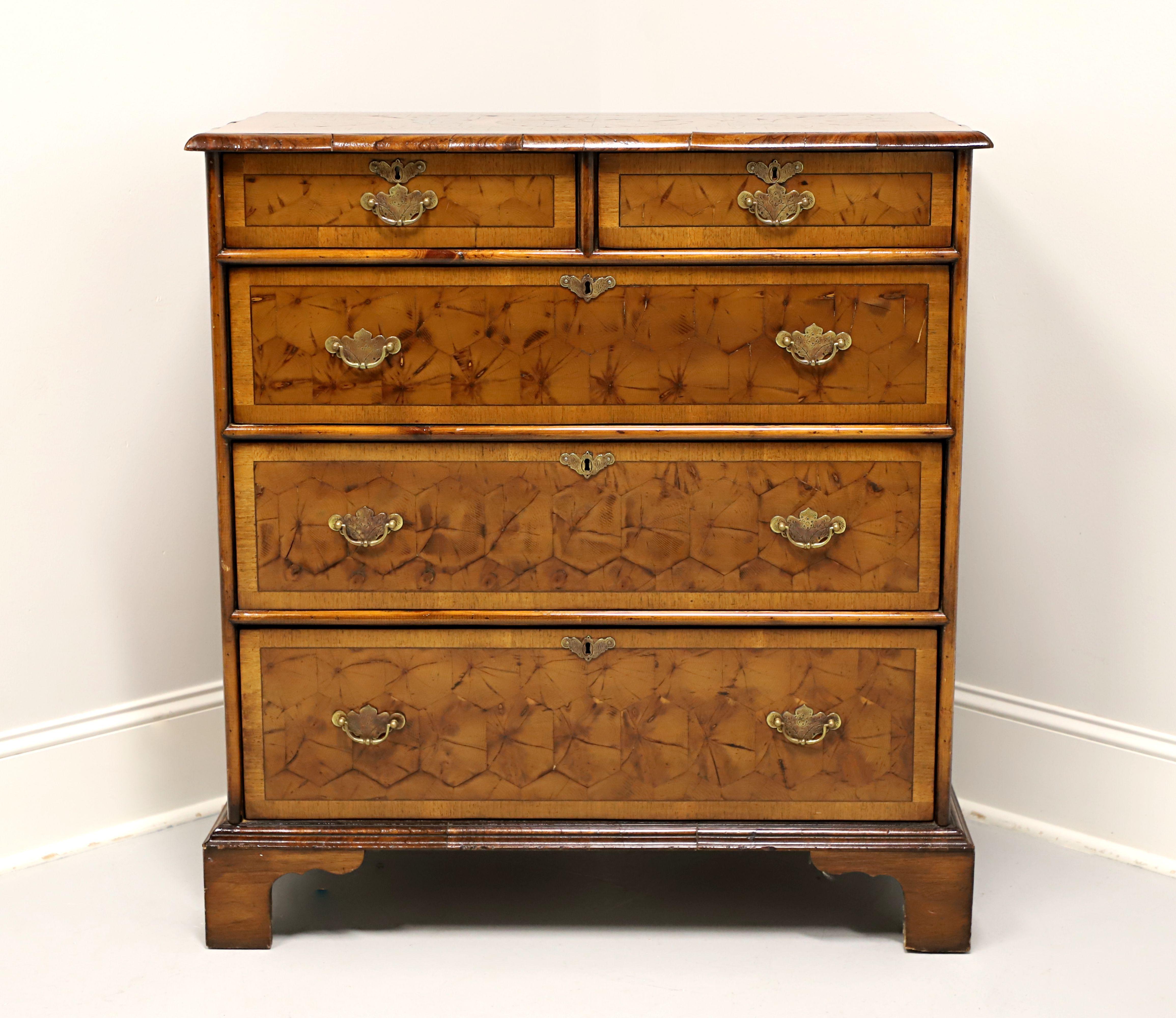 An antique Chippendale style chest of drawers, likely originating in England, in the 19th Century. Oyster veneer of Laburnum wood. Parquetry design to top with oyster bullnose edge, brass hardware, banded drawer fronts, and bracket feet. Features
