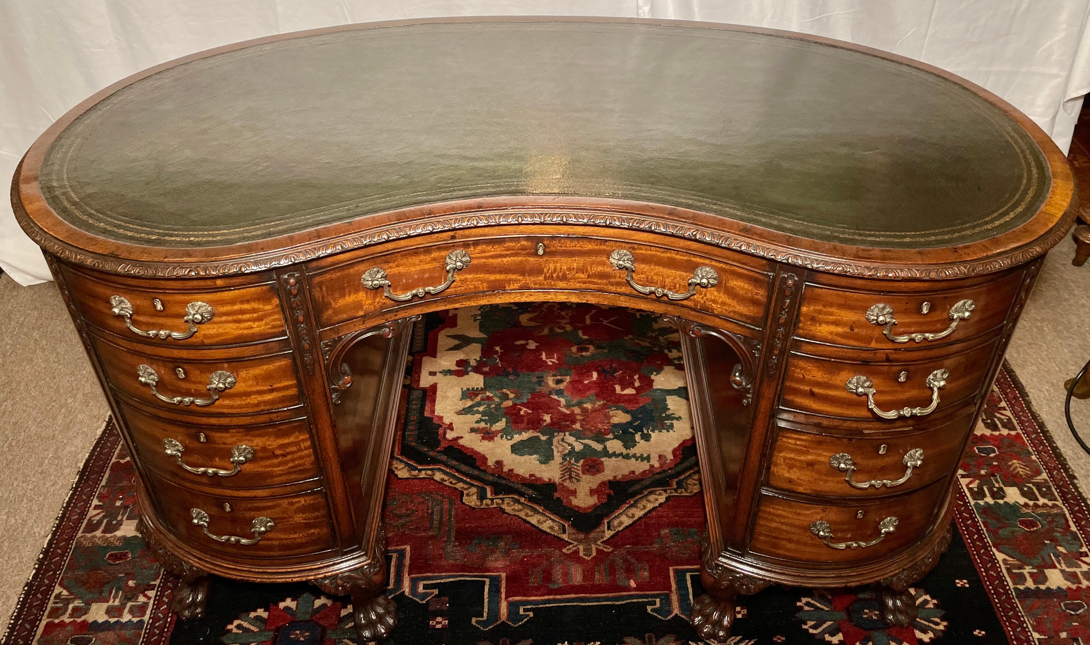 Antique English Chippendale Mahogany Kidney shaped leather-top desk, Circa 1880.