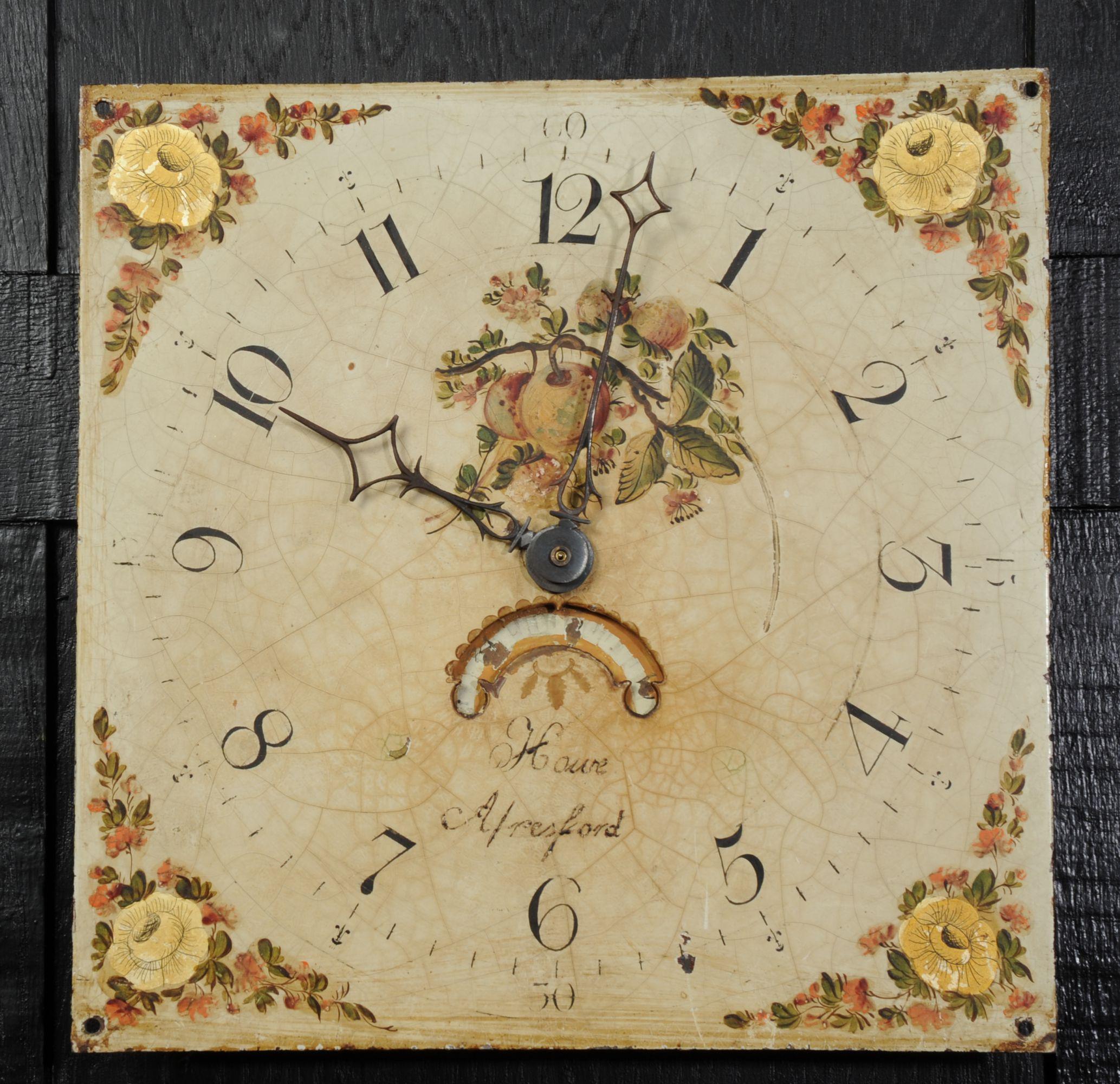 A lovely antique iron clock dial circa 1830 in it's original enamel, charmingly decorated with country garden flowers. With ancient craquelure, marks of a long life and it's original hand cut iron hands, all as found by our buyer on a local estate.