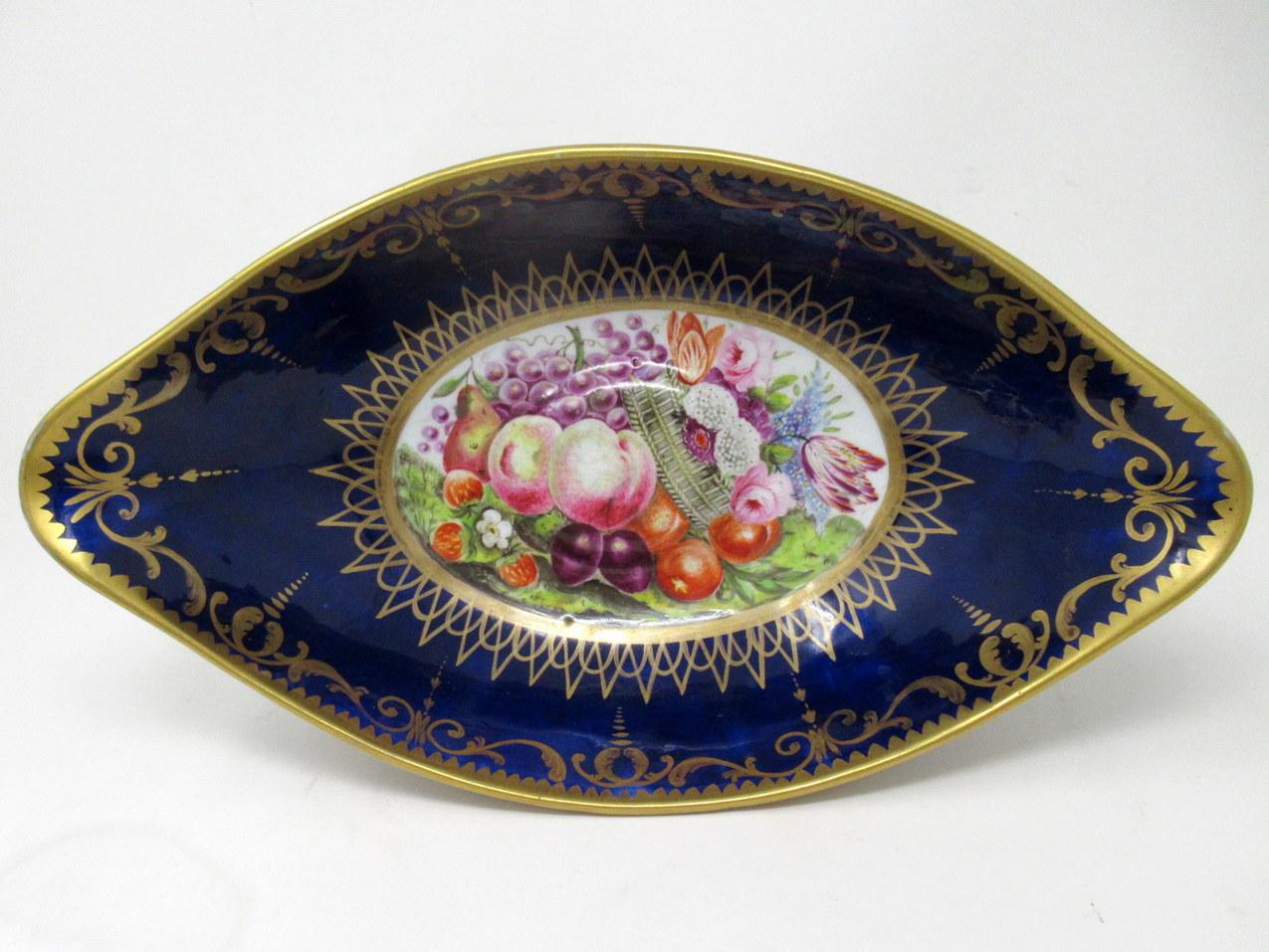 An exceptionally Fine Quality English Coalport hand decorated pedestal Centerpiece of oval outline. First half of the Nineteenth Century.  

The main outer body of oval outline in cobalt blue with lavish gilt scrolling detail, the inner bowl with