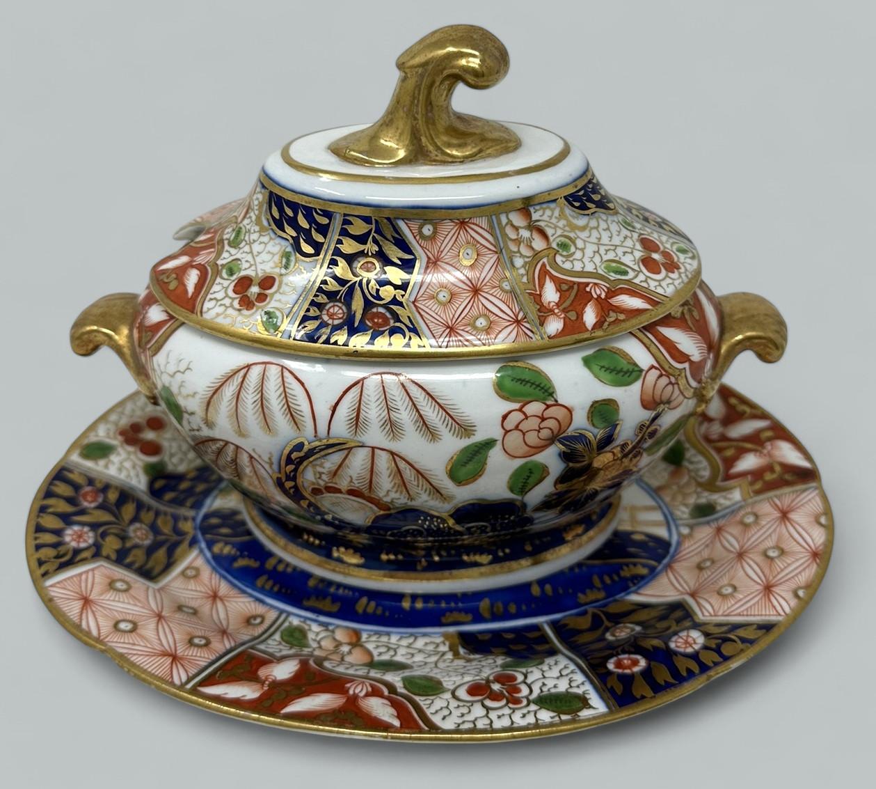 Wonderful Rare example of an early English Porcelain China Sauce or Food Tureen complete with original cover and undertray, possibly made by Coalport or Rockingham. First quarter of the Nineteenth Century, Regency period. 

Lavishly hand decorated