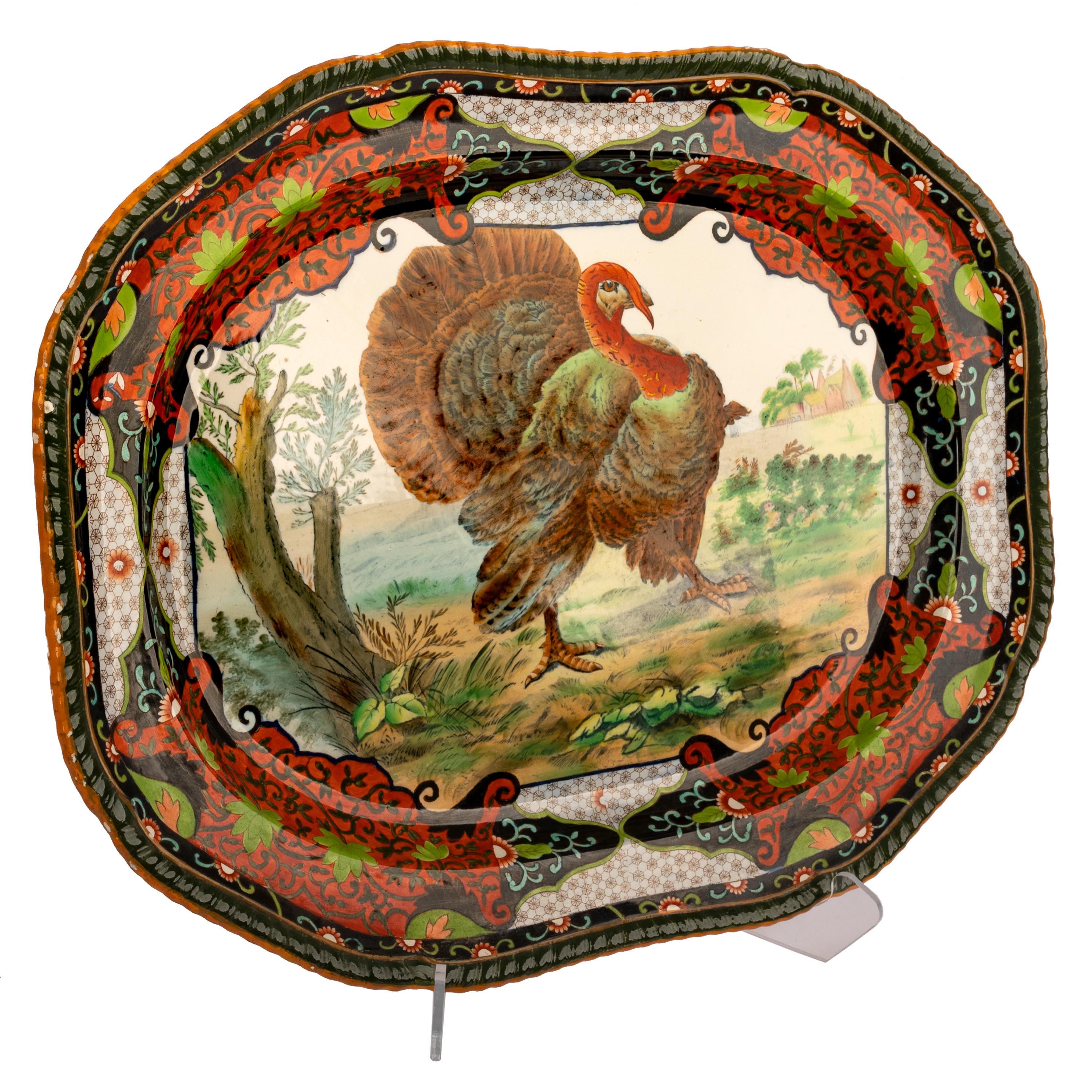 Large antique English copeland spode thanksgiving ironstone Turkey plater, 1894.
This turkey serving platter made for the American market in the late 19th century, transfer printed with a turkey to the center in a woodland setting. The border