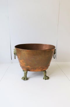 Antique English Copper and Bronze Firewood Log Holder with Lion Heads
