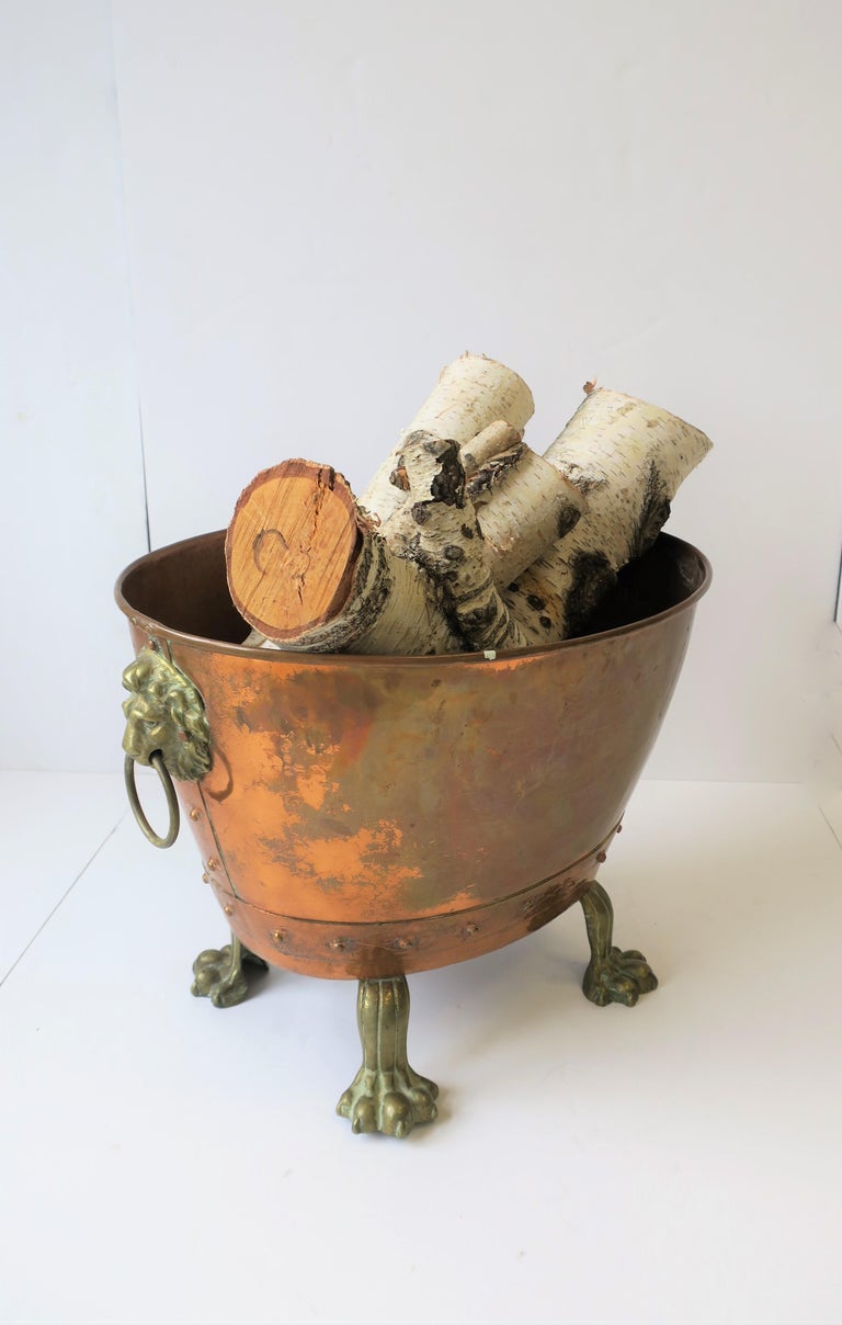 Antique English Copper and Bronze Firewood Log Holder with Lion Heads