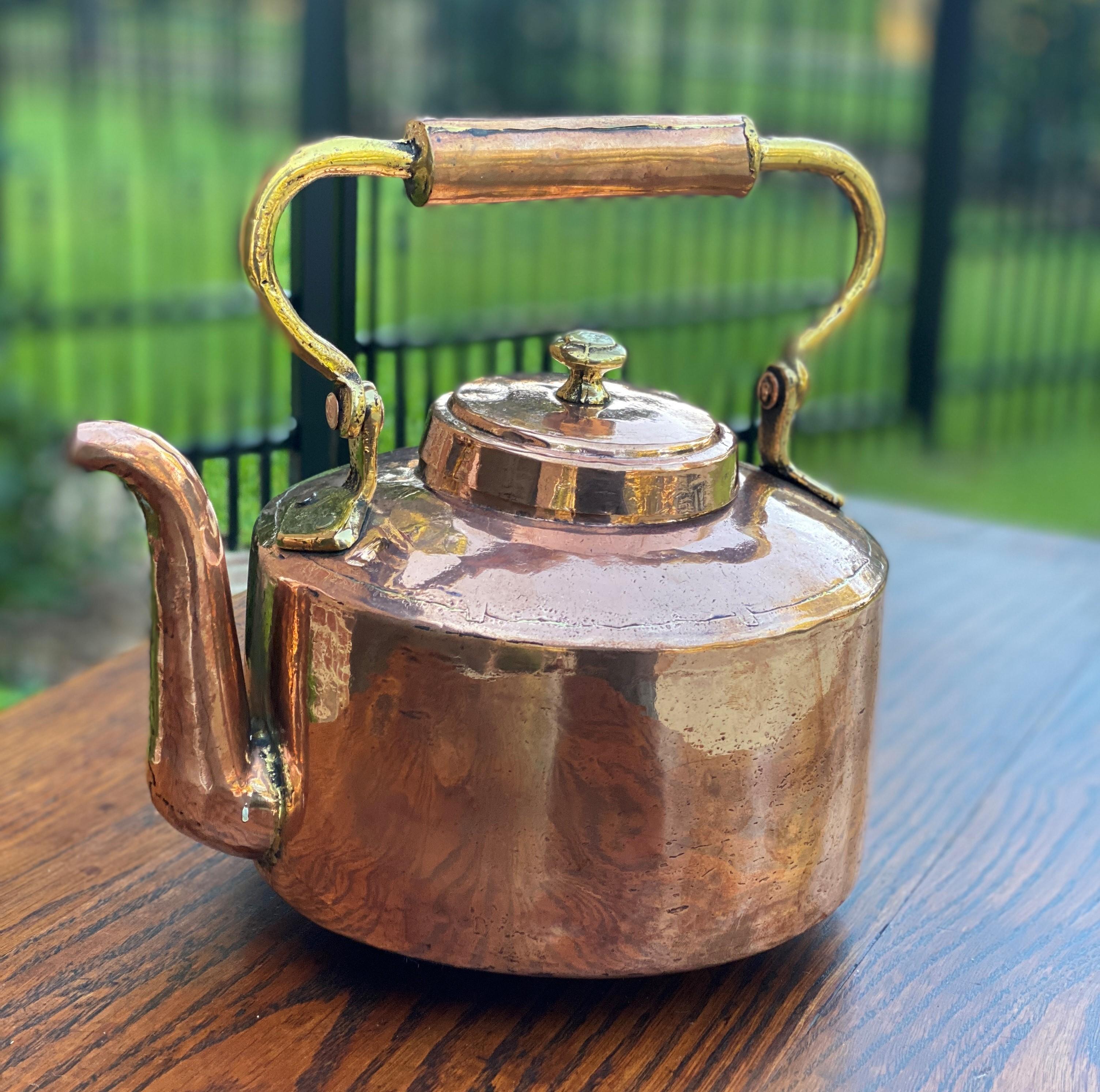 Charming antique English copper & brass tea kettle~~hand-seamed~~c. 1900 
Excellent copper kettle with lid~~handle is brass

Measures: 9
