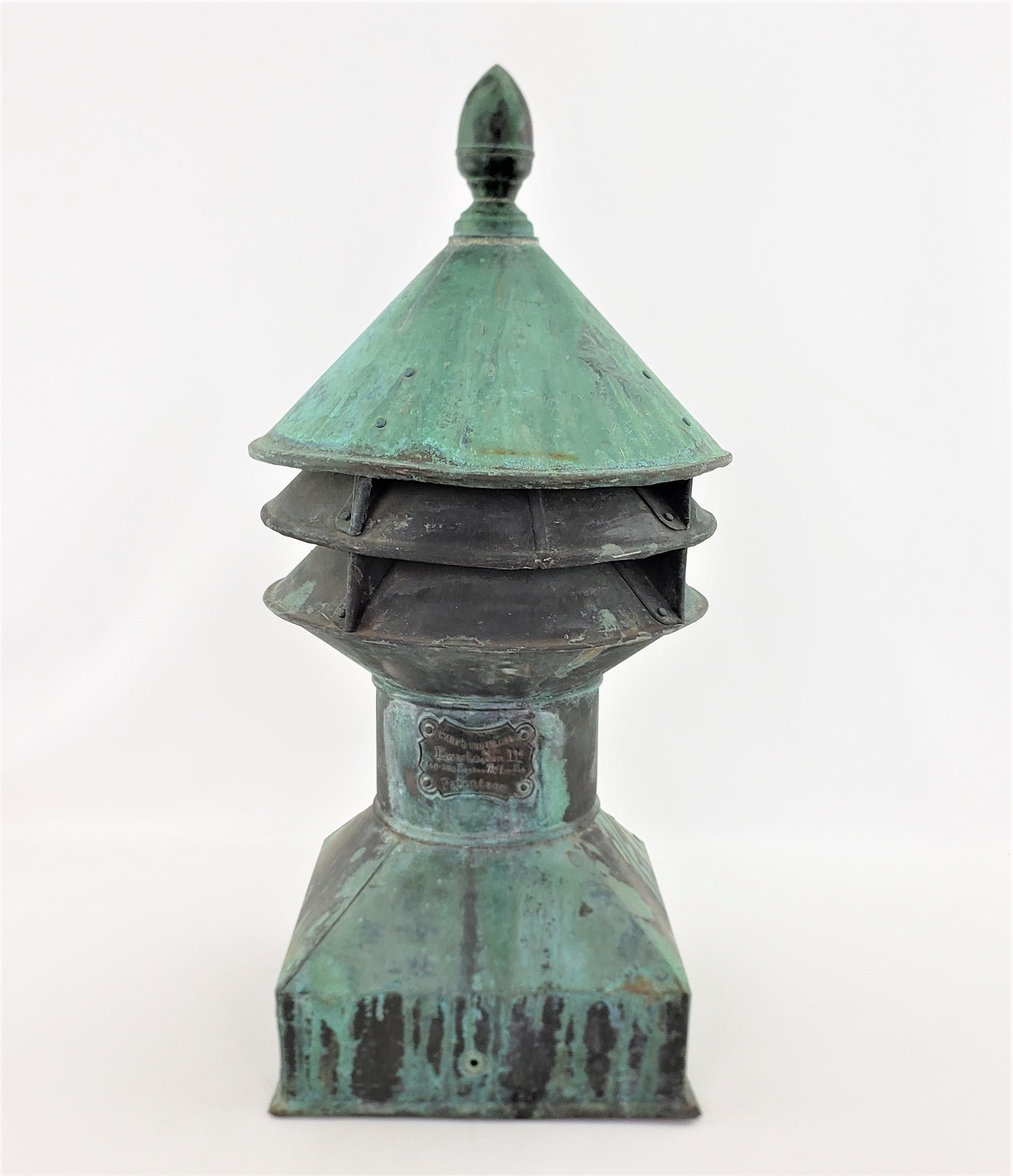 This large and substantial chimney vent cap was made by Ewart & Sons of London England and dates to approximately 1900 and done in a period Edwardian style. Ewart & Sons was well known for copper products such as water heaters and also diversified