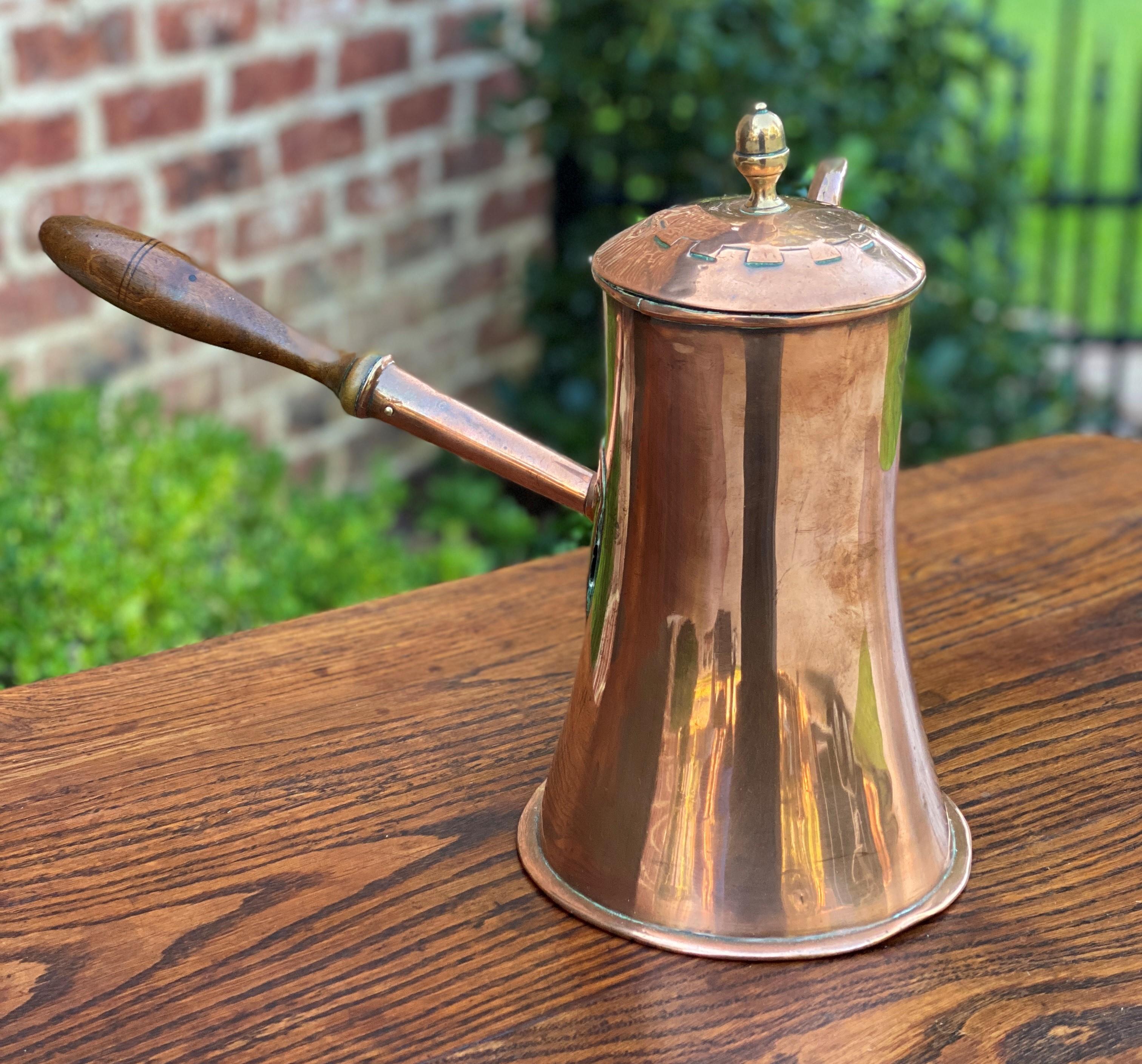 Beautiful and unique antique English copper tea or coffee kettle with pour spout, hinged lid, and wood handle~~hand-seamed~~c. 1900

Measures: 9