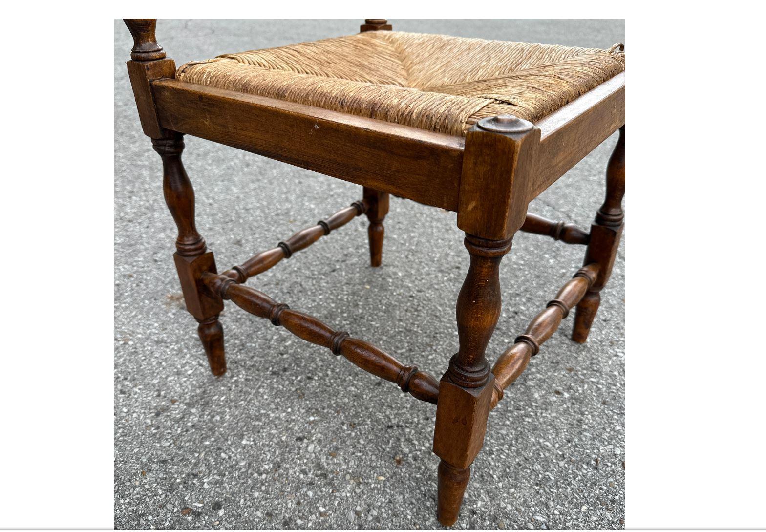 This stunning English chair has the most beautiful and delicate detailing in the woodwork. The details are beautiful and would look incredible in a more traditional or English styled home. The rush seats are in great shape and really tie the piece