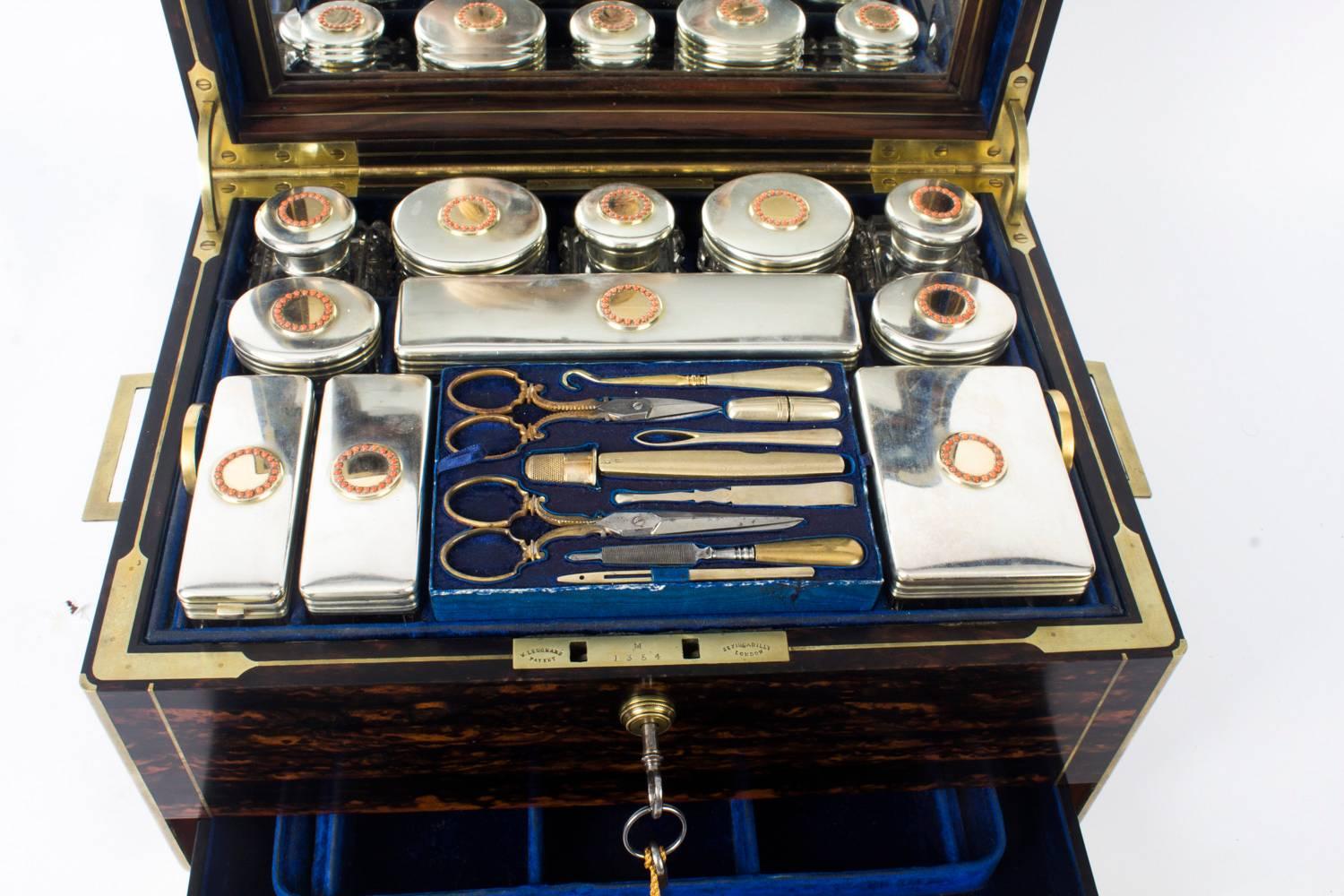 This is a superb antique Victorian lady's Coromandel brass banded and brass inlaid travelling dressing case, by Leuchars, 38 Piccadilly, London and circa 1870 in date.

The beautiful interior is fitted with silver mounted cut glass bottles and jars