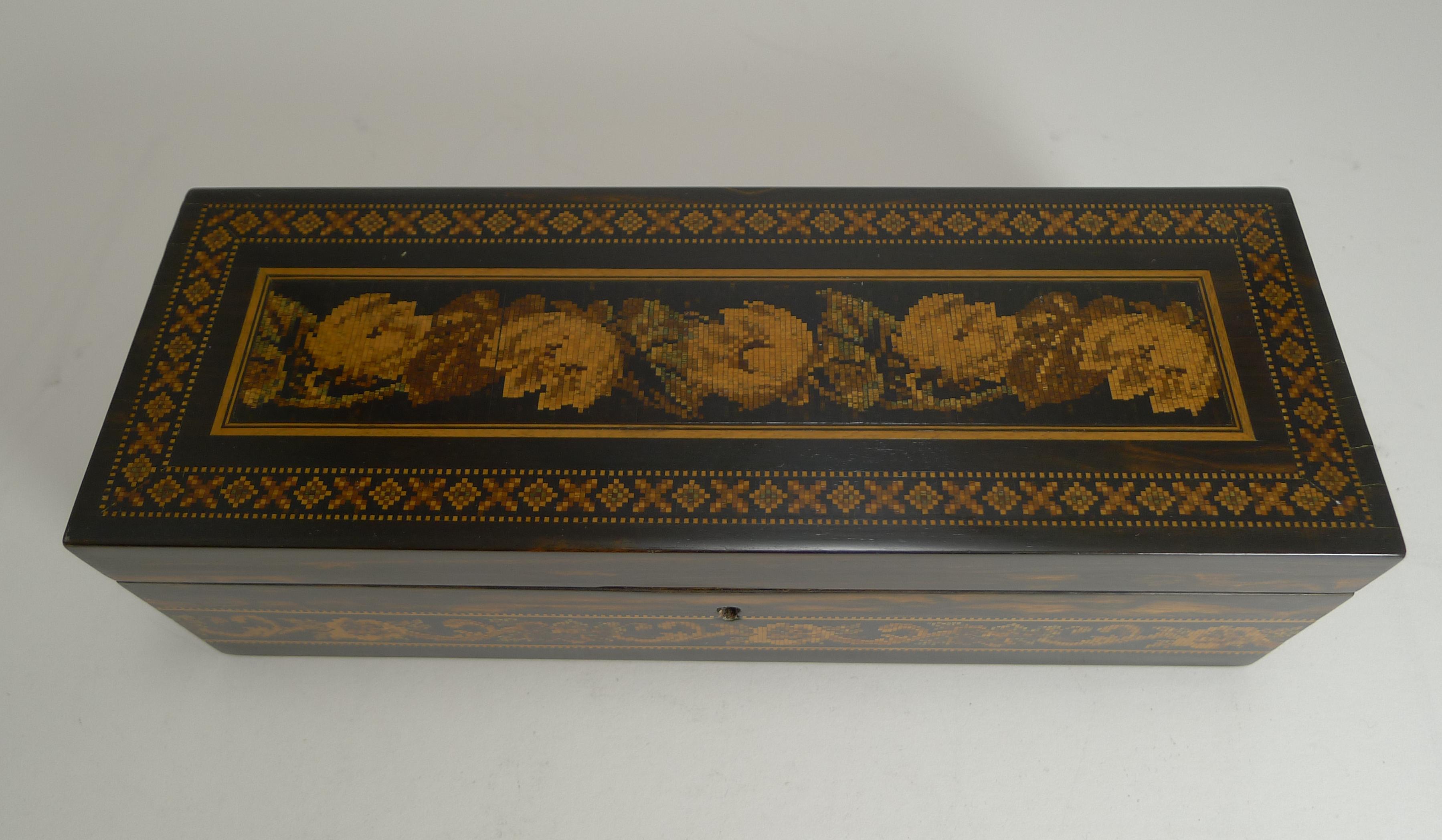 A superb glove box dating to the mid-19th century with the highly sought-after combination of exotic Coromandel wood and micro-mosaic Tunbrdige Ware / Tunbridgeware.

The interior has been professionally re-lined in a hand-marbelled paper and the