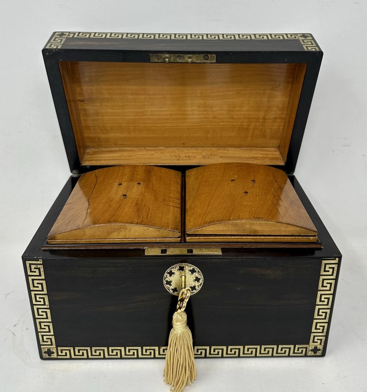 Stunning and exceptional example of a well grained Fully Fitted Double Coromandle Tea Caddy of compact proportions, early Nineteenth Century, of English origin.
The rectangular hinged lid opening to reveal two lift out original interior satinwood