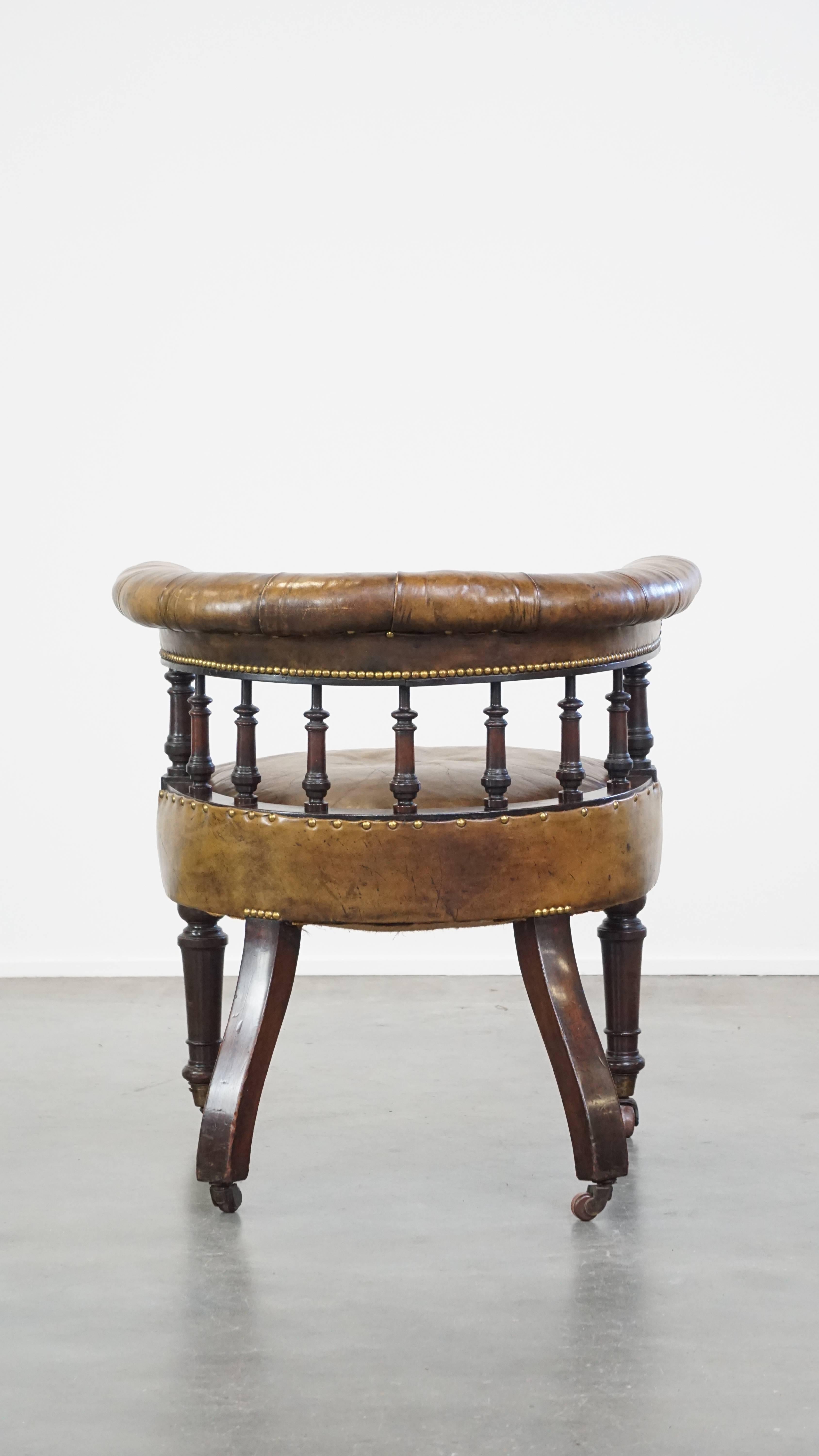 Hand-Crafted Antique English cowhide leather desk chair combined with wood on original wheels For Sale