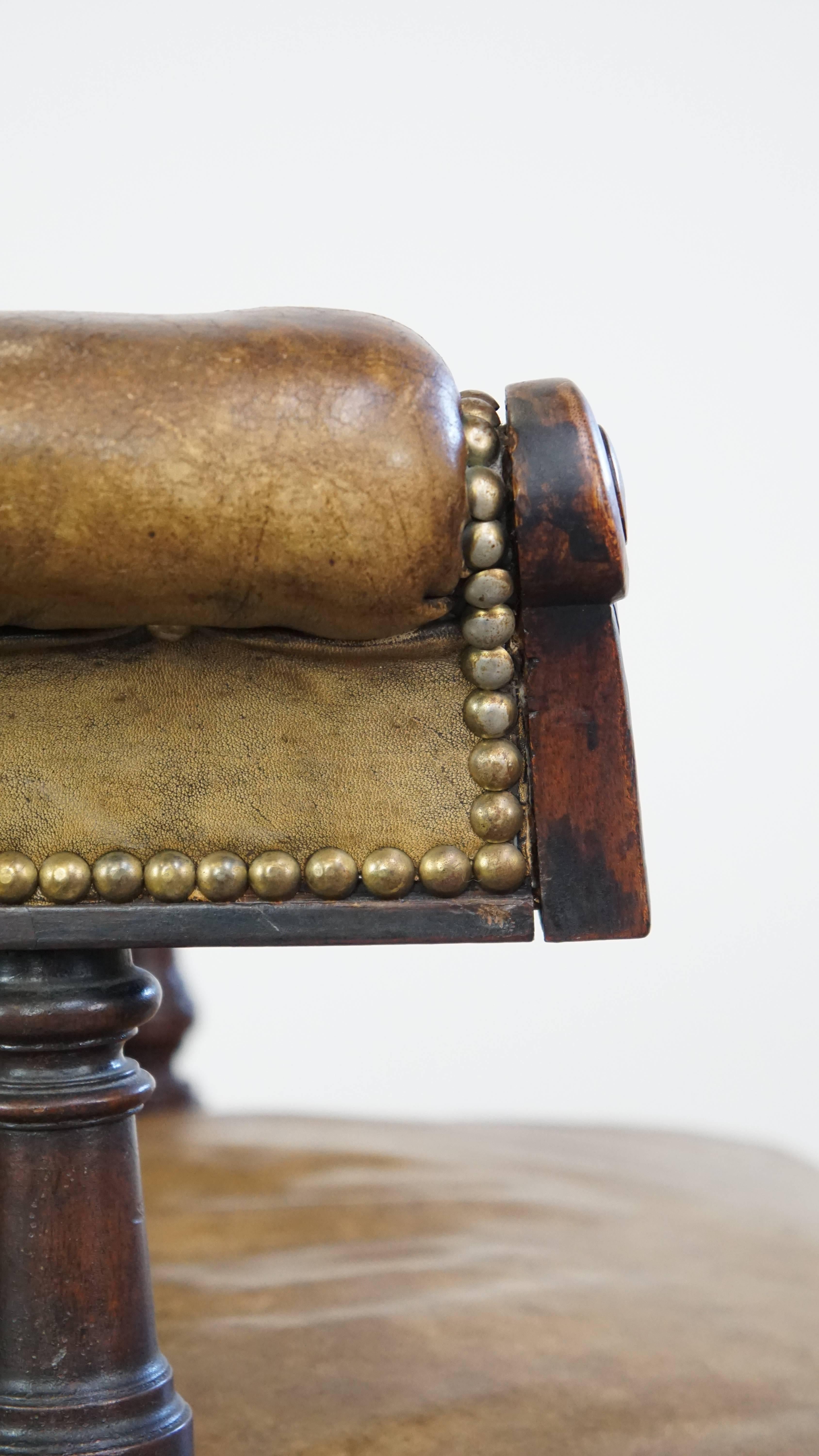 Cowhide Antique English cowhide leather desk chair combined with wood on original wheels For Sale