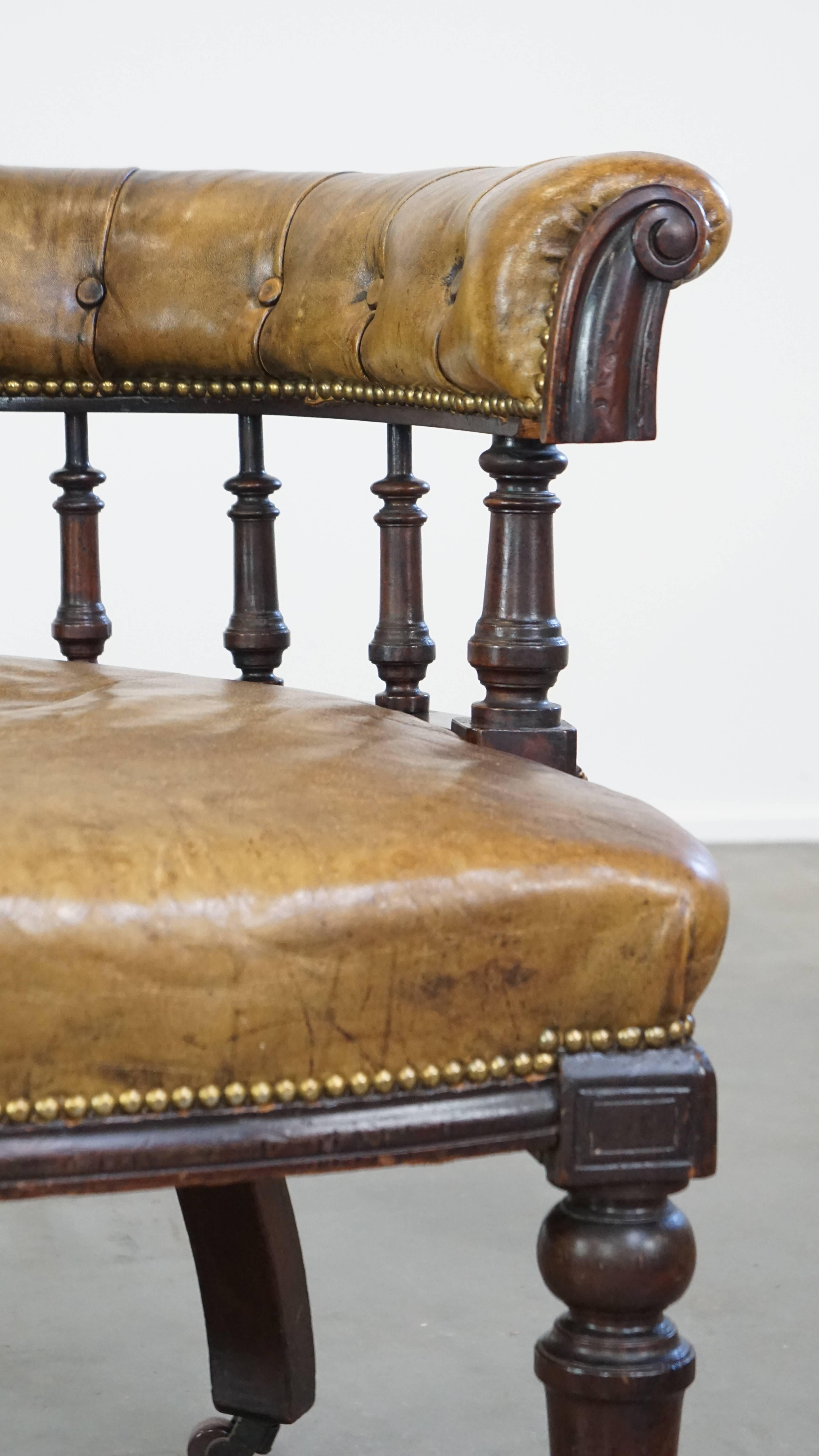 Antique English cowhide leather desk chair combined with wood on original wheels For Sale 2