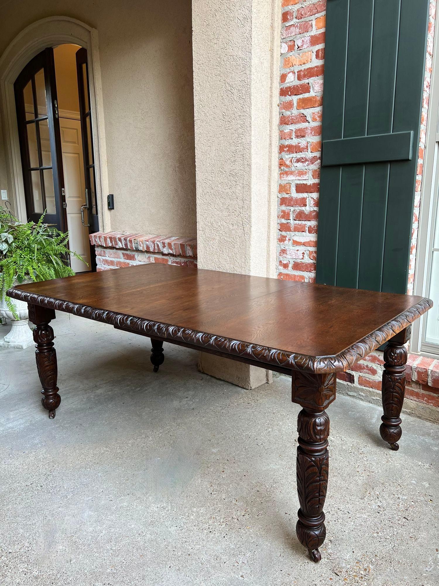 Antique English Crank Dining Table Carved Oak Expandable Leaf Edwardian.

Direct from England, a fabulous antique English Edwardian dining table with original crank and additional leaf!  Thick oak construction that features wide, carved beveled