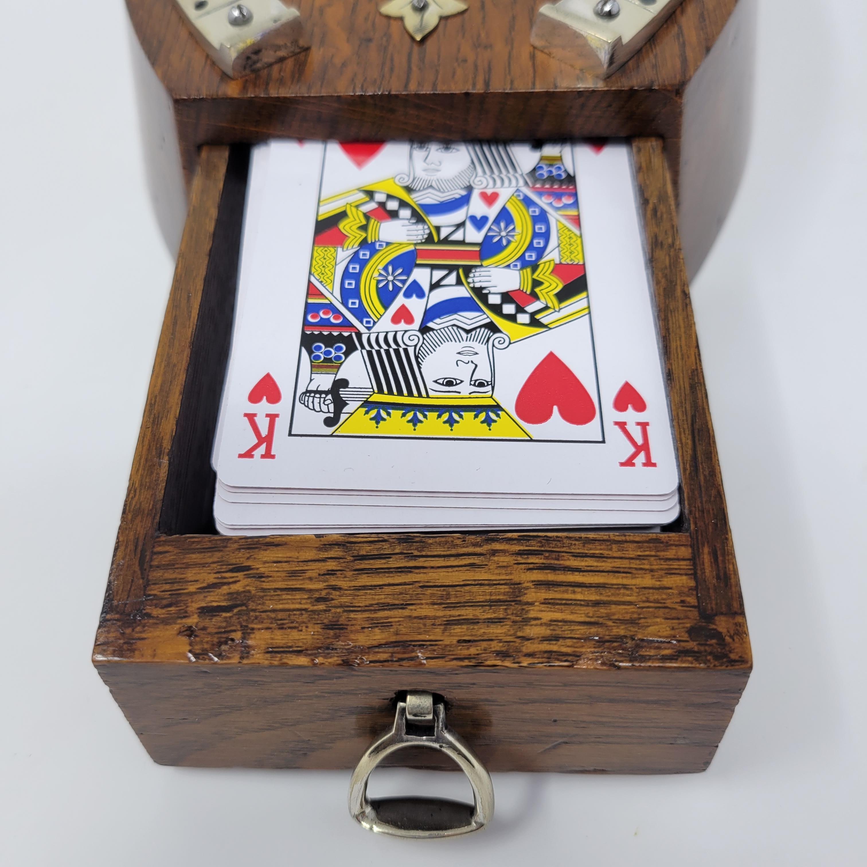 A very clever card box, designed in the shape of a horseshoe with a stirrup closure.