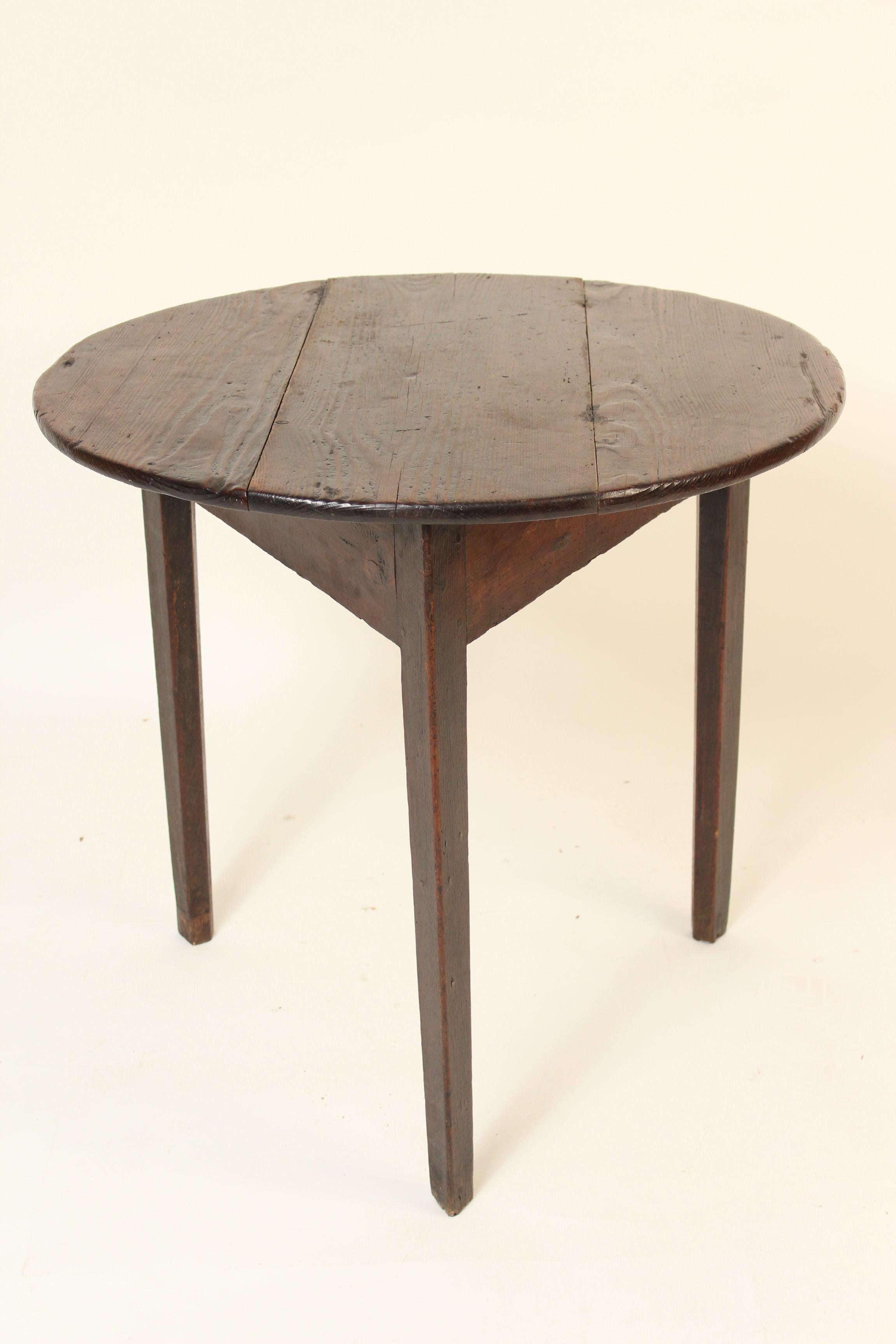 Antique English oak and pine cricket table, 19th century. The top and under bracing / apron are pine. The legs are oak.