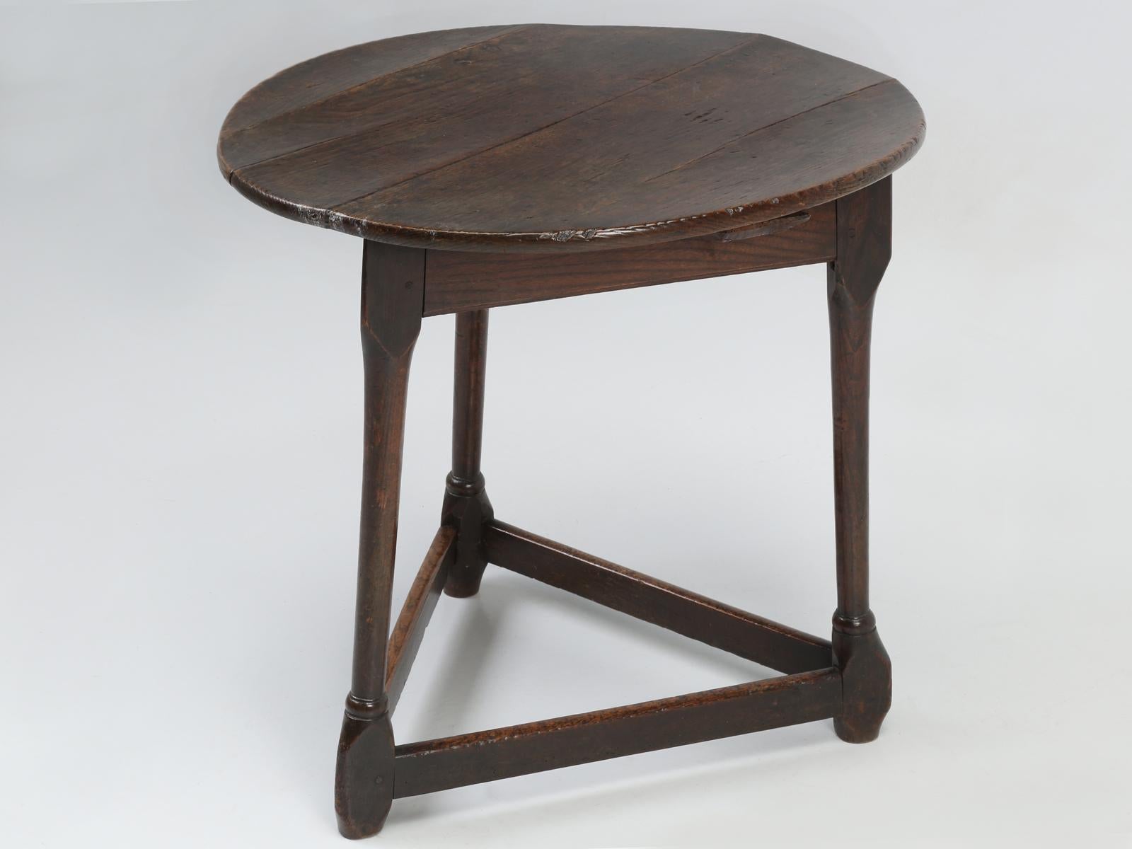 This is a great un-restored antique English cricket table and when we started buying English antiques circa 30-years ago, these were quite common. Now, trying to find an un-restored antique English cricket table, with a sensational original patina,