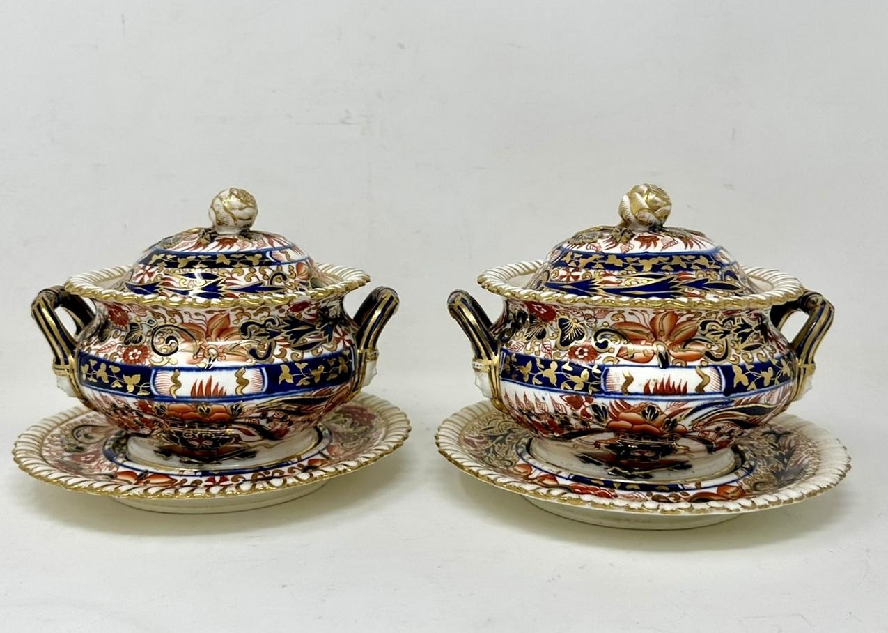 Wonderful Rare Identical Pair of Early English Porcelain China Sauce or Food Tureens complete with their original covers and undertrays, possibly made by  Royal Crown Derby or Rockingham. Mid to late Nineteenth Century. 

Lavishly hand decorated in