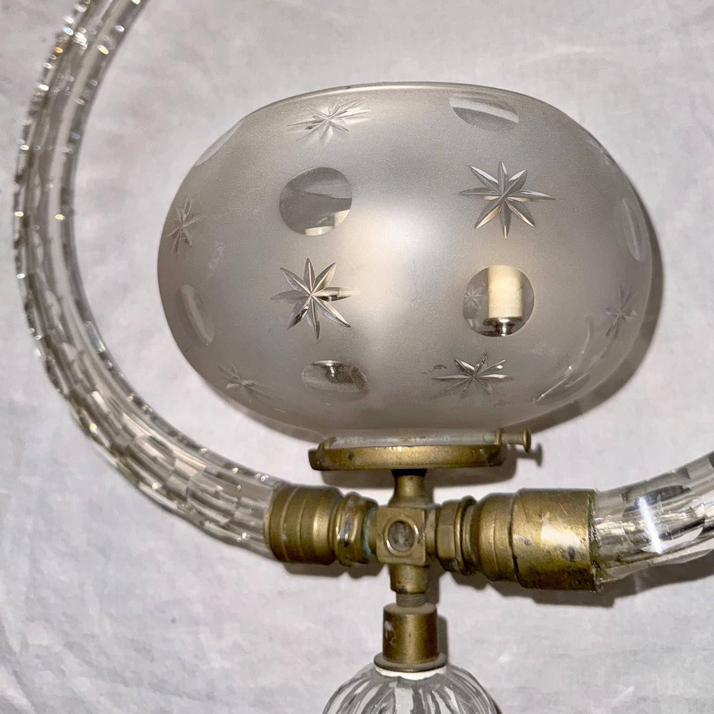 A circa 1920's English cut crystal light fixture with 3 candelabra interior lights.

Measurements:
Height:35