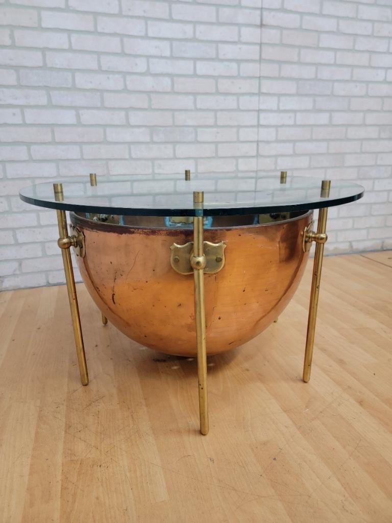 Antique English custom copper and brass with round glass top kettle drum table

Early 20th century English custom copper kettle drum with brass legs and custom fabricated thick-cut round glass-top accent table. Rare and unique custom antique