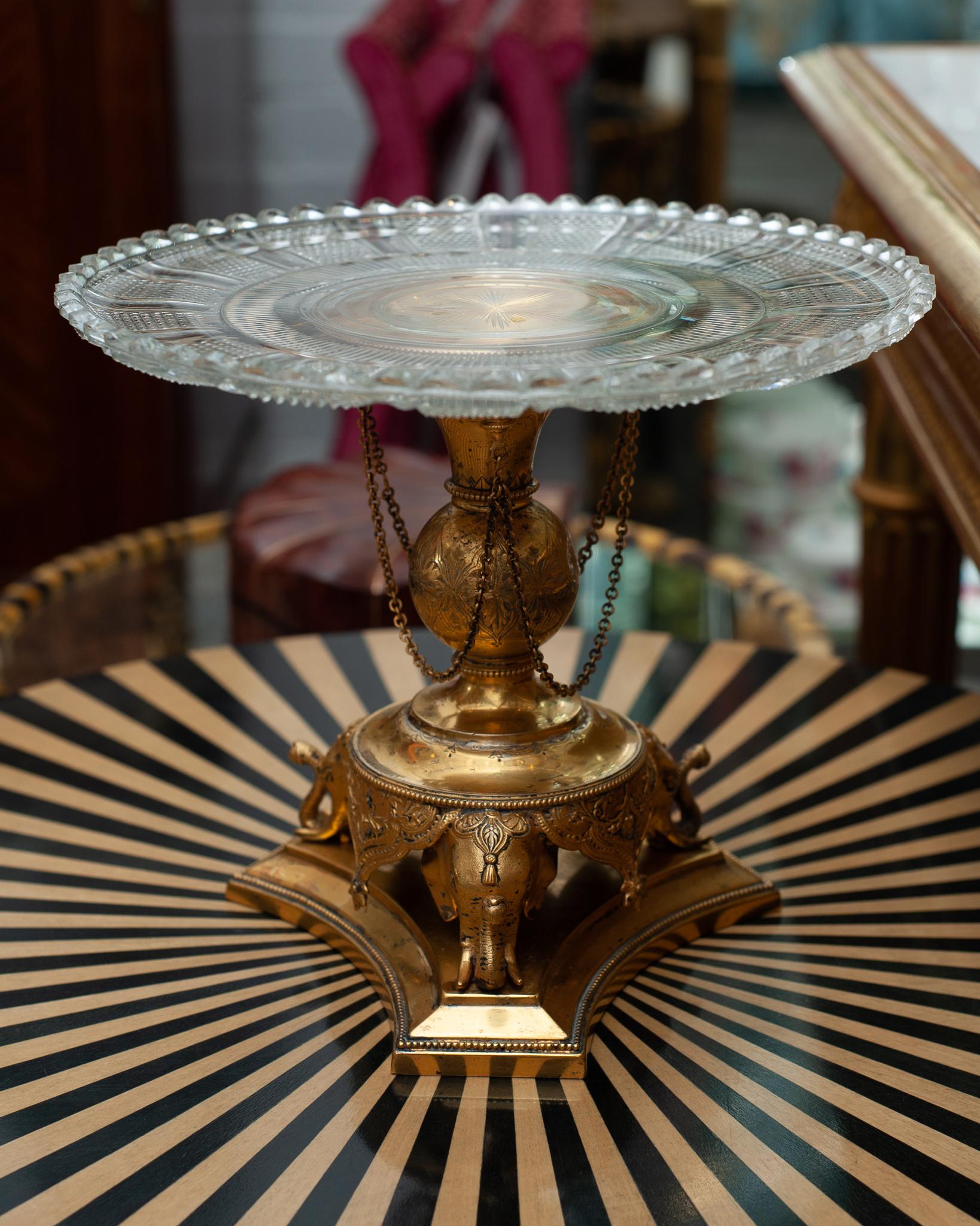 A stunning and beautifully made antique English cut crystal and bronze tazza with elephant motif, made circa 1890. Bronze trims are in good condition for their age and the elaborate hand cut crystal catches the light.