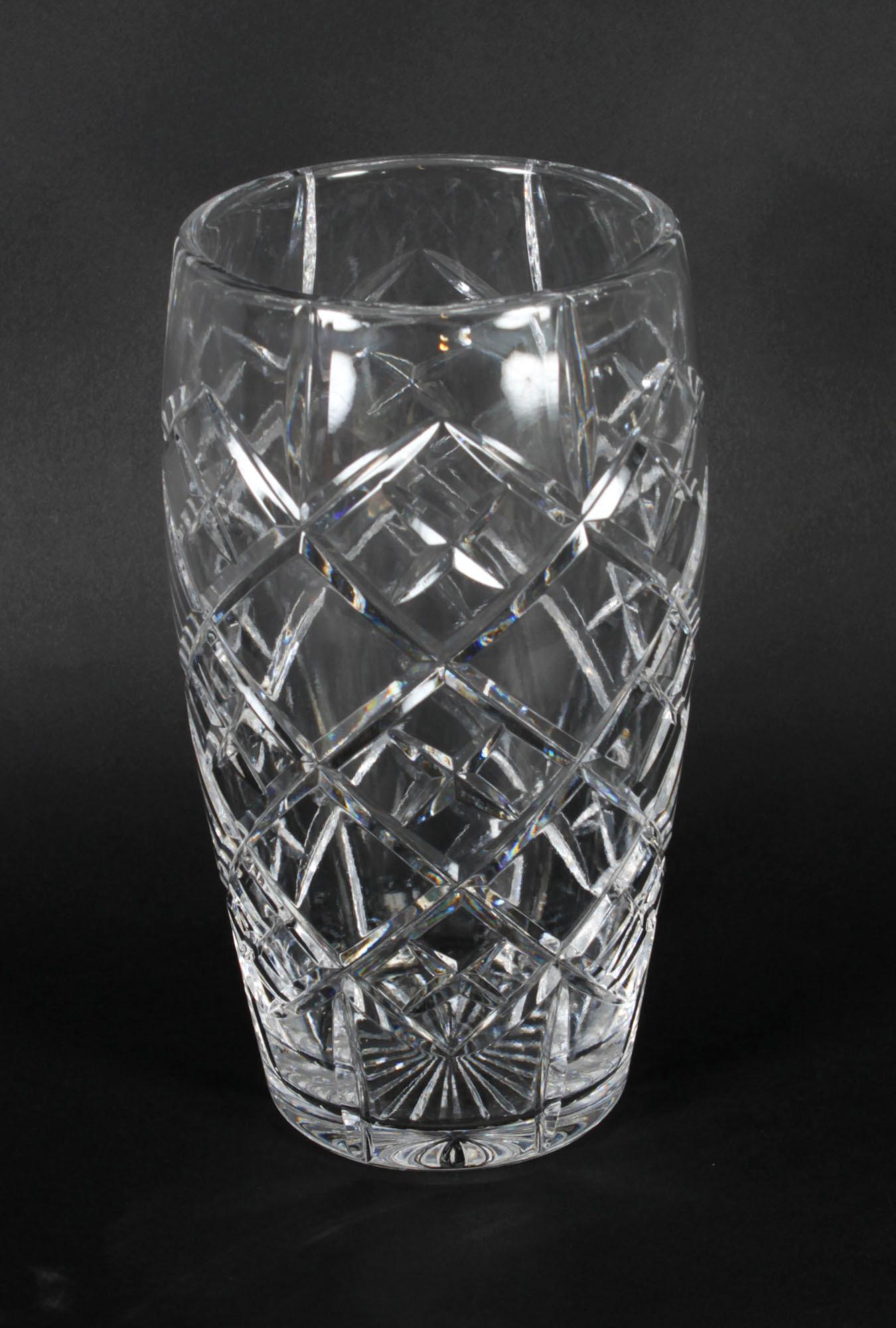 This is a splendid English antique cut crystal vase, circa 1900 in date.
 
This wonderful cylindrical vase is ideal for almost any floral arrangement, while the vase itself boasts stability and comforting weight. It features beautiful relief