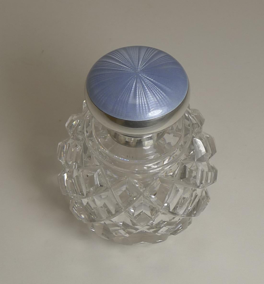 A wonderful clean example of an antique perfume or scent globe made from heavy crystal, deeply cut, wonderfully tactile.

The collar and hinged lid are made from solid English sterling silver hallmarked for London 1911, together with the makers