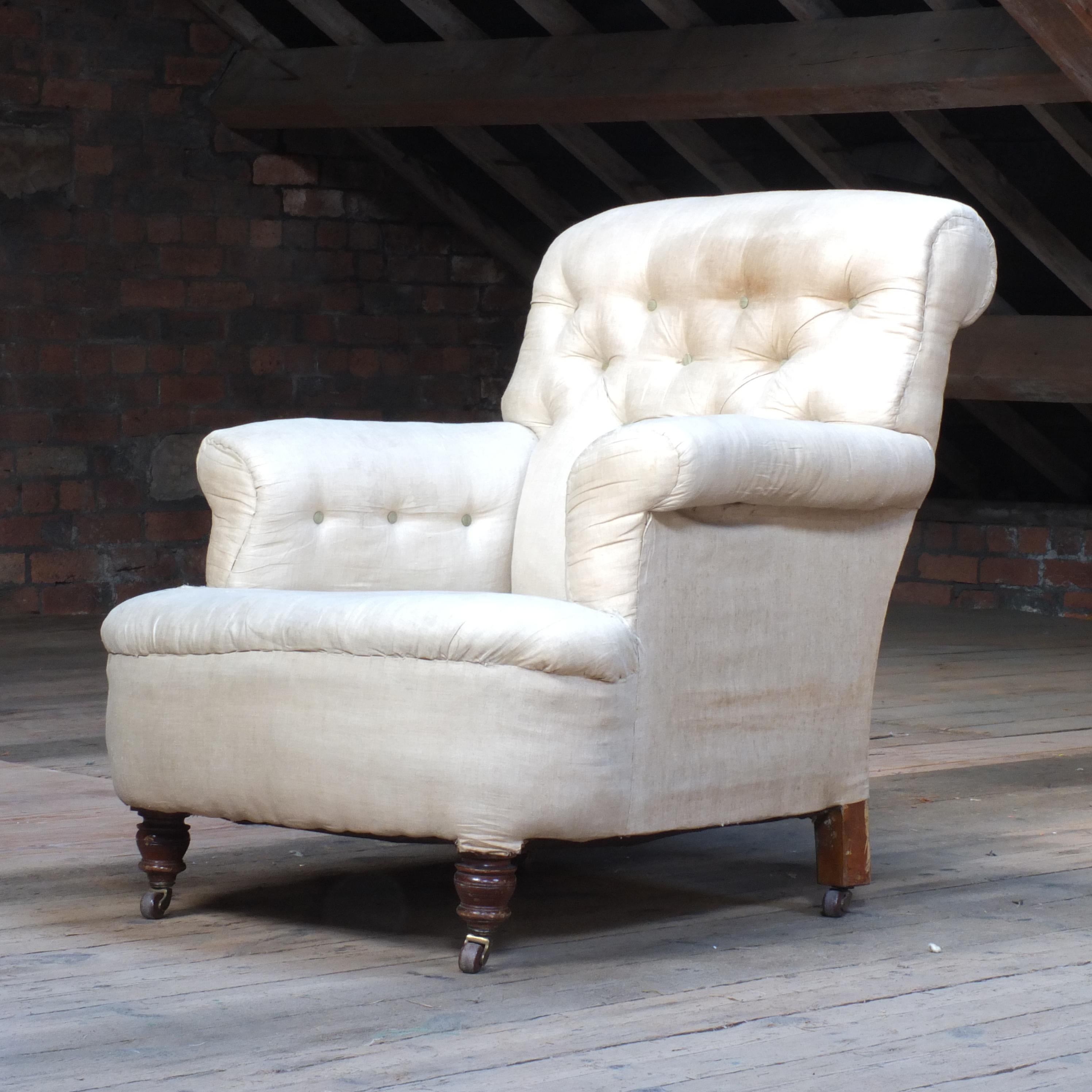 A large deep seated 19th late century country house armchair. A very comfortable chair with the sprung seat, back and overstuffed upholstery. In good solid shape throughout however the current calico upholstery is in tatty conditions and does need