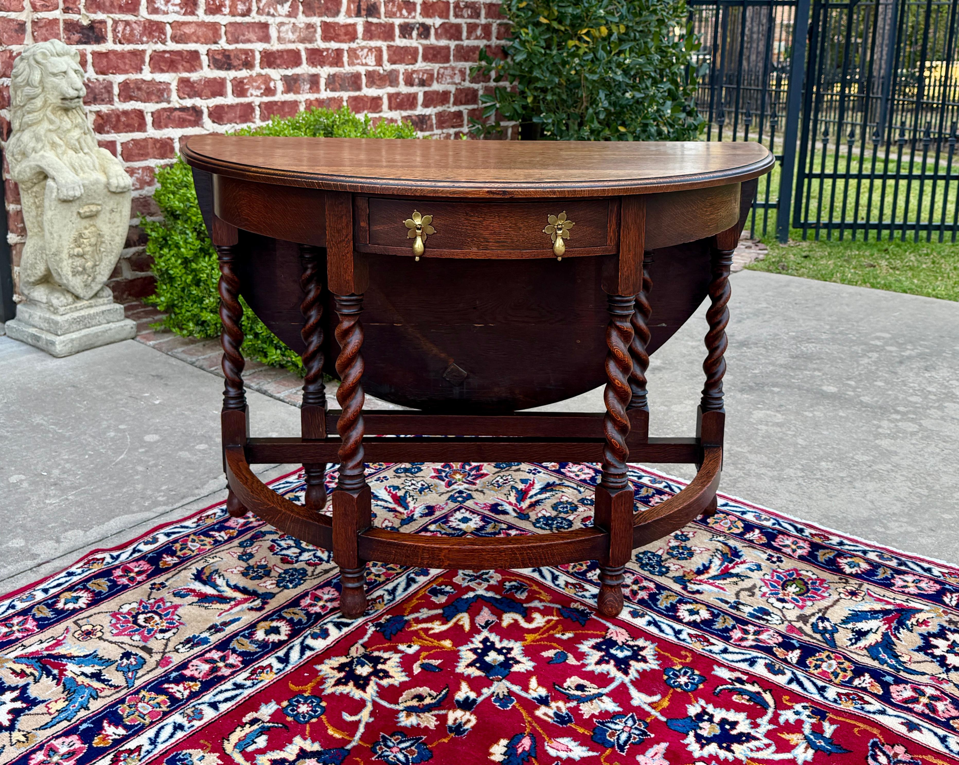 CHARMING and UNIQUE Antique English Honey Oak Demilune Drop Side Gateleg Table with Drawer~~Barley Twist Legs~~ROUND When Fully Opened~~  

        Solid and sturdy with very nice honey oak patina 

        Versatile size
        28