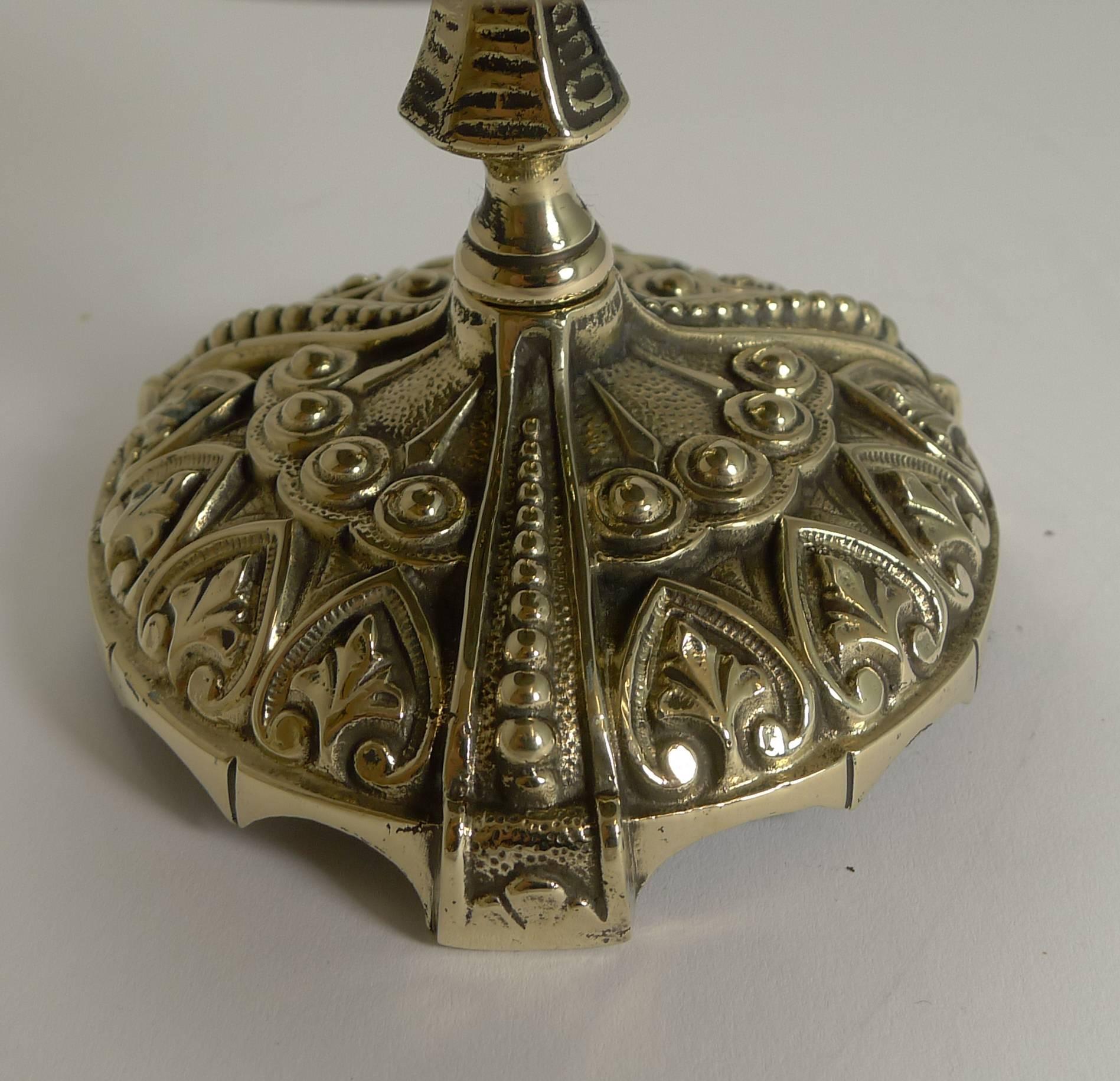 A wonderful and highly decorative desk or counter bell, my favourite kind with the more unusual clapper to the side rather than the ones you ring from the top. The hinged clapper is released and gives a clear and authoritative ring.

A true