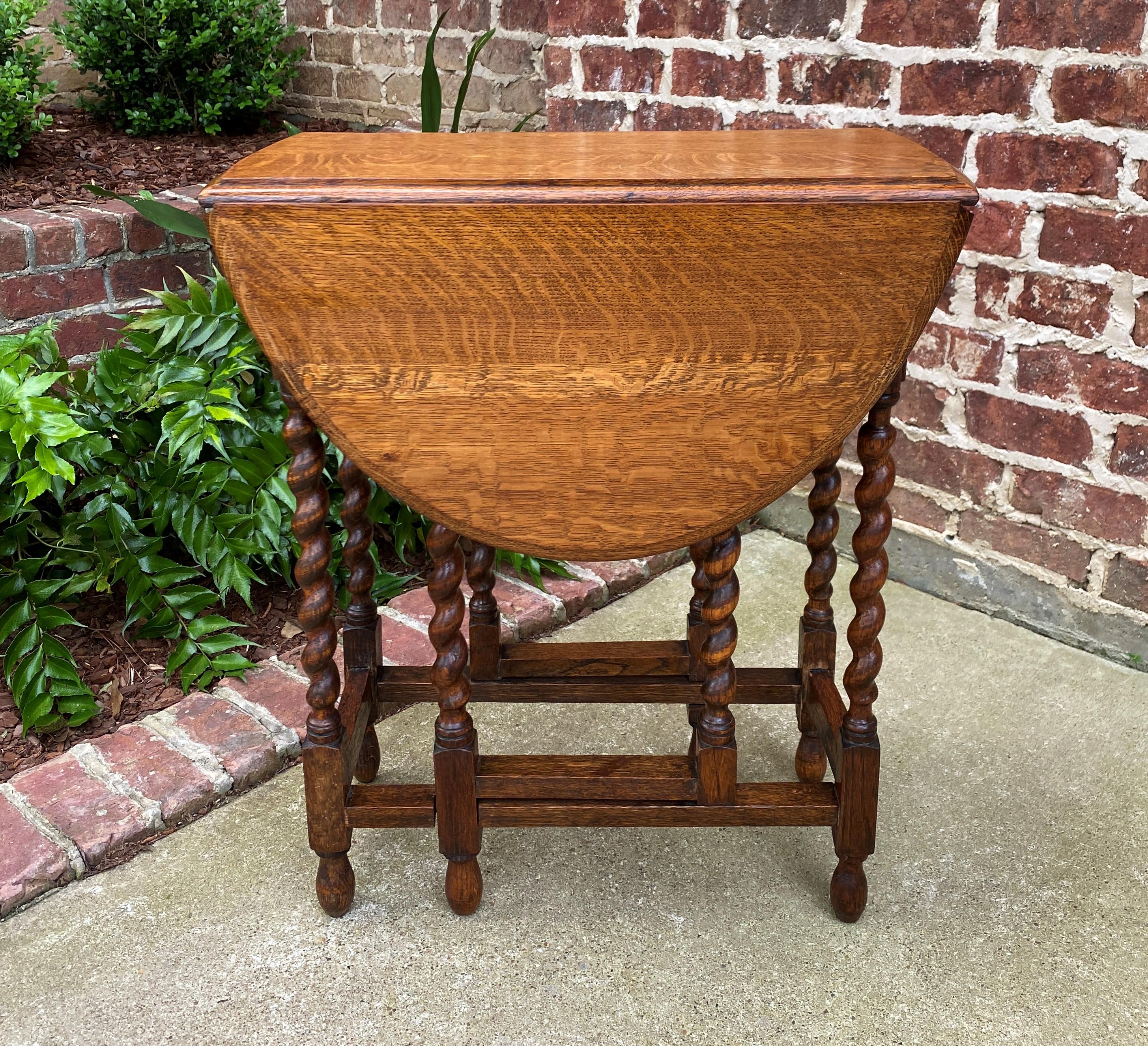 Beautiful Antique English honey oak drop leaf gateleg oval table~~barley twist legs~~c. 1920s.

Always in high demand~~hard-to-find small size drop leaf table.

 Solid and sturdy~~very nice oak patina.

 Versatile size
 28.25
