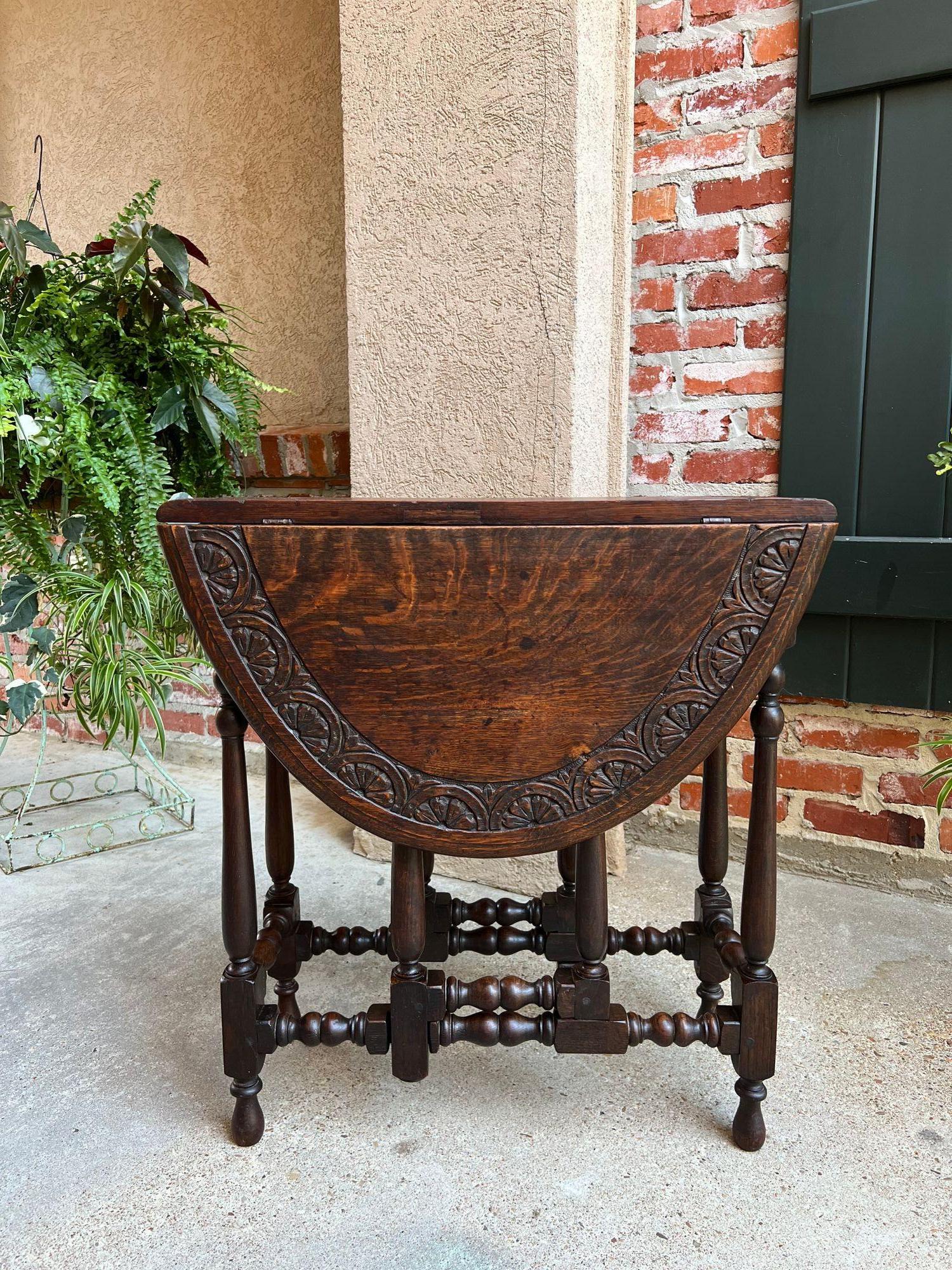 Antique English drop leaf side sofa table petite carved oak Jacobean gate leg.
 
Direct from England, (YES, our English container finally arrived, and we have some amazing English antiques, and of course, lots of barley twist)! This is a beautiful