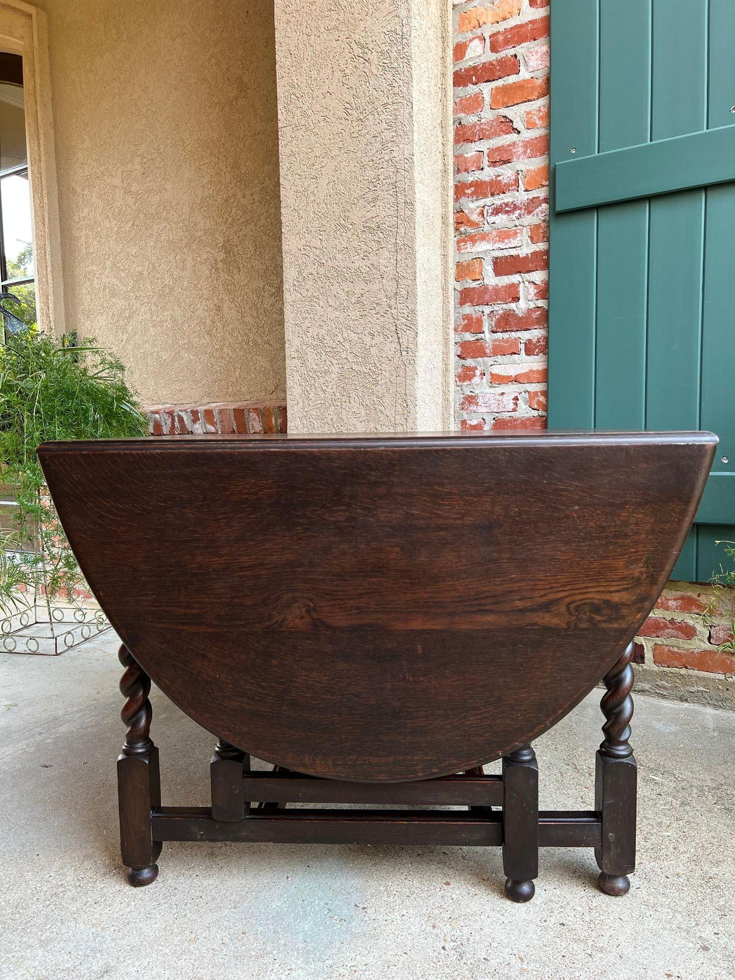 Antique English Drop Leaf Sofa Kitchen Table BARLEY TWIST Tiger Oak Gate Leg.

Direct from England, a beautiful and large antique drop leaf, gate leg table.
British barley twist legs on the table and the gates, EIGHT barley twist legs in total!