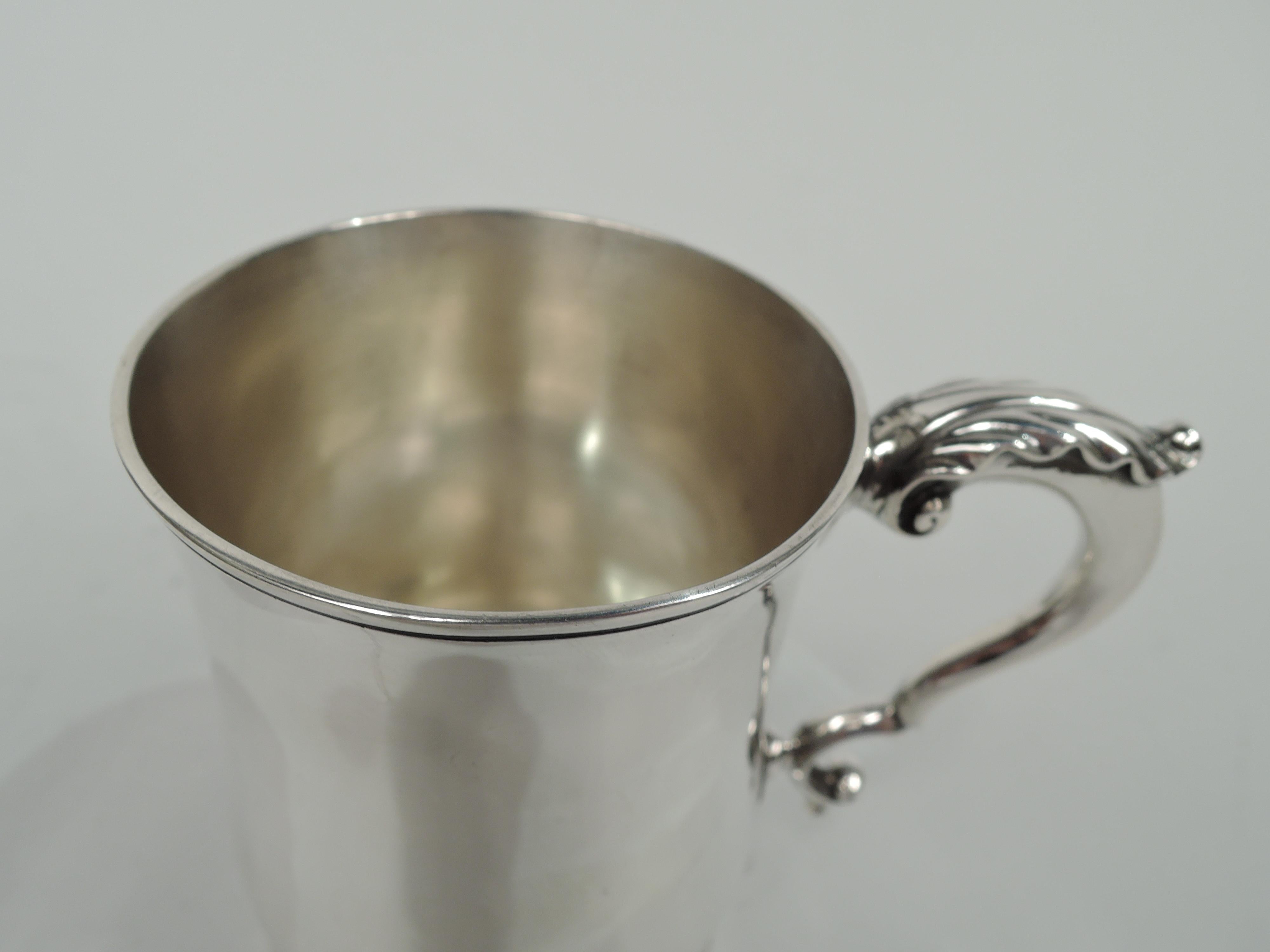 Edwardian sterling silver baby cup. Made by Holland, Adwinckle & Slater in London in 1904. Baluster with leaf-capped double-scroll handle and stepped foot. Traditional form with plenty of room for engraving. Fully marked. Weight: 5 troy ounces.