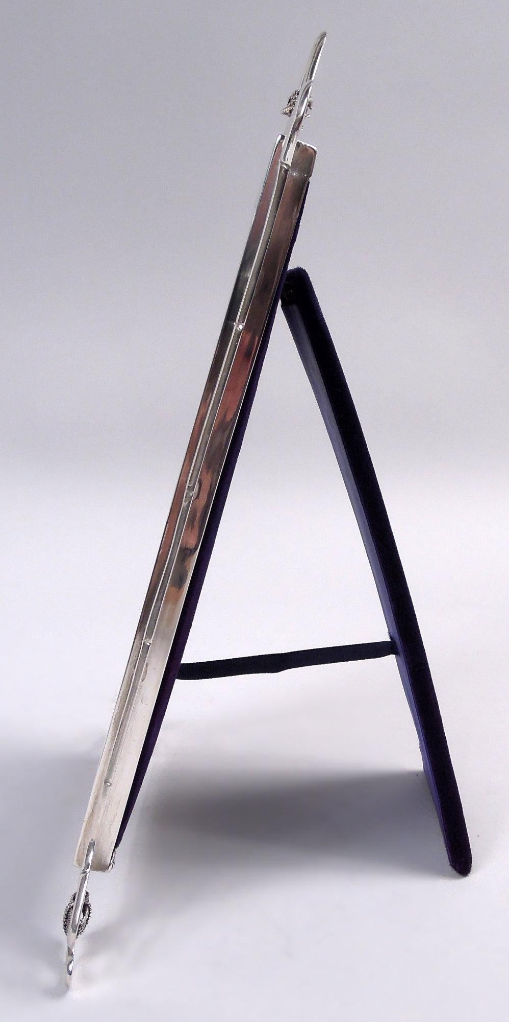 Edwardian Classical sterling silver picture frame. Made by James Samuel Bell & Louis Willmott in 1902. Rectangular surround mounted with curvilinear bamboo stalks forming crown and supports tied with cabled wire. Interior surround rim scrolled at