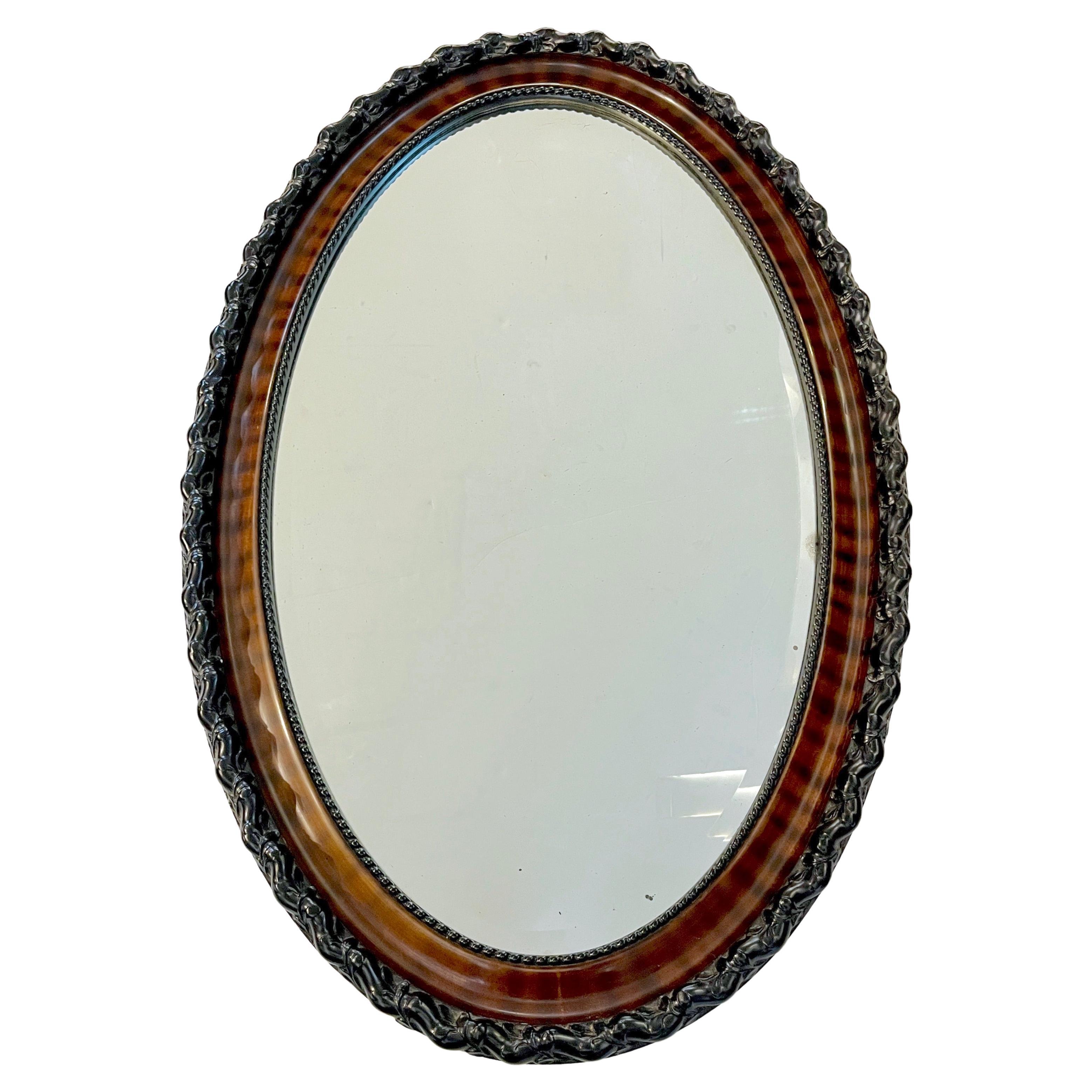 Antiker englischer Edwardian Ebenholz Makassar Furnier Schwarz Braun Oval Spiegel im Angebot