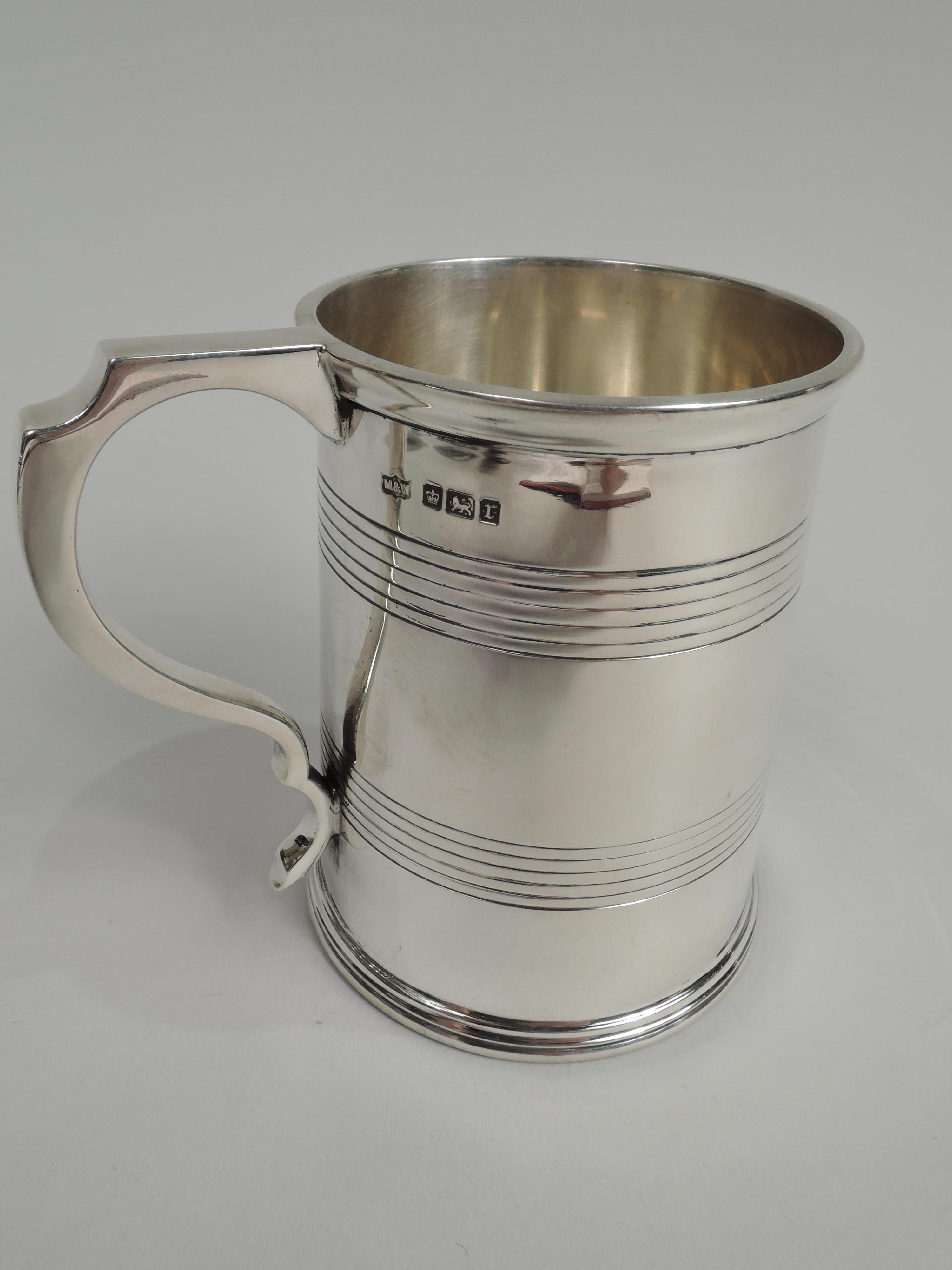 Edwardian Georgian sterling silver baby cup. Made by Mappin & Webb in Sheffield in 1909. Straight and upward tapering sides with reeded bands and double-scroll handle. Traditional with nice heft and plenty of room for engraving. Fully marked.