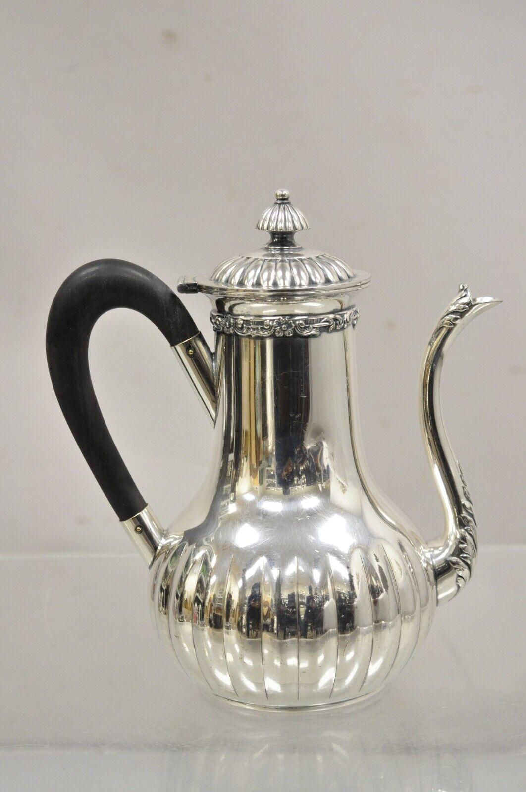 Antique English Edwardian James W Tufts Silver Plated Tea Pot Coffee Pot. Item featuring Wooden handle, original hallmark, nice antique item. Circa Early 20th Century. Measurements: 9