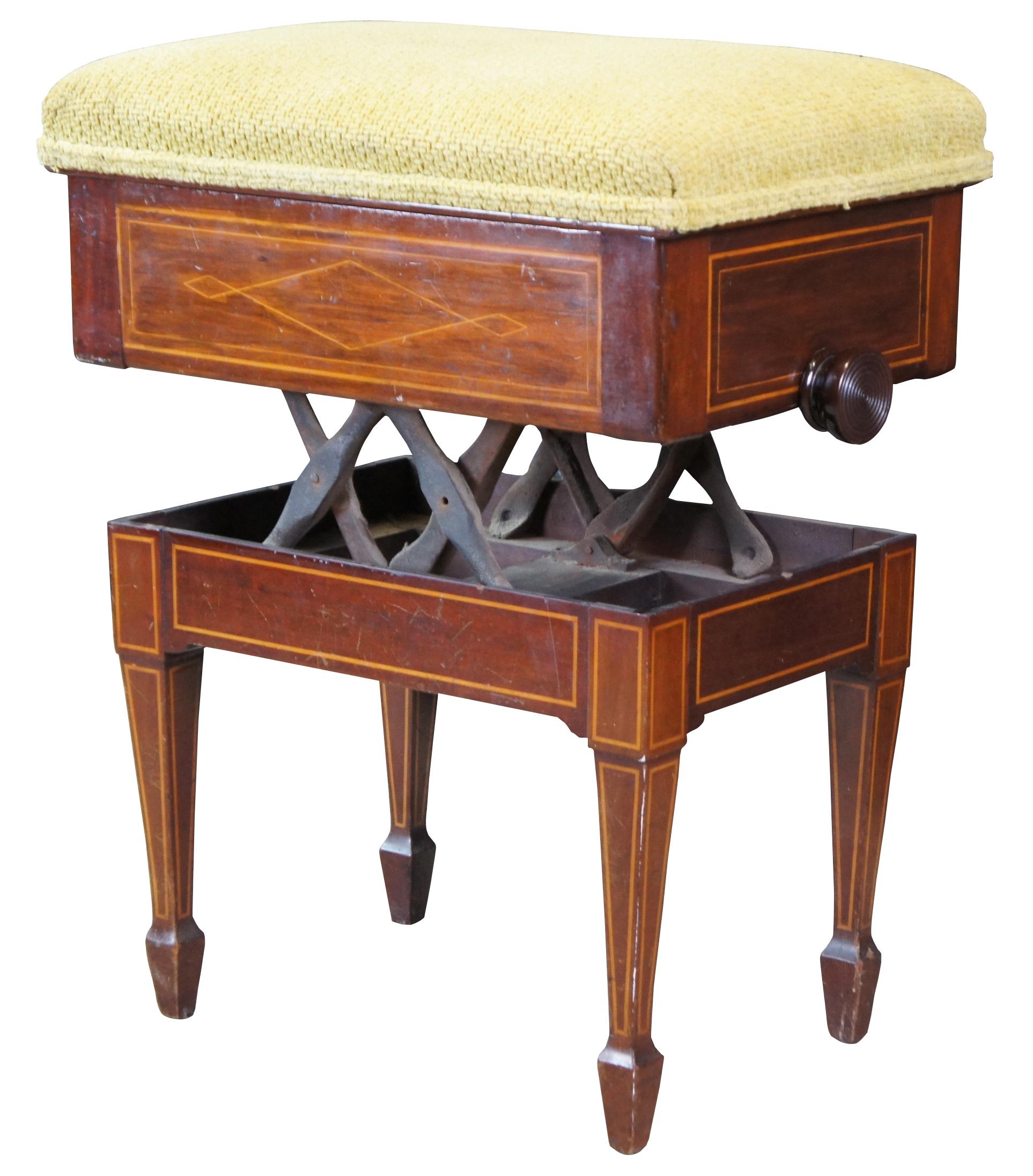 Early 1900s Edwardian artists organ, vanity or piano stool. A rectangular form made from mahogany with elegant inlay and upholstered seat. Features an adjustable seat that raises by scrolling side handles. Upholstered seat lifts up to allow for