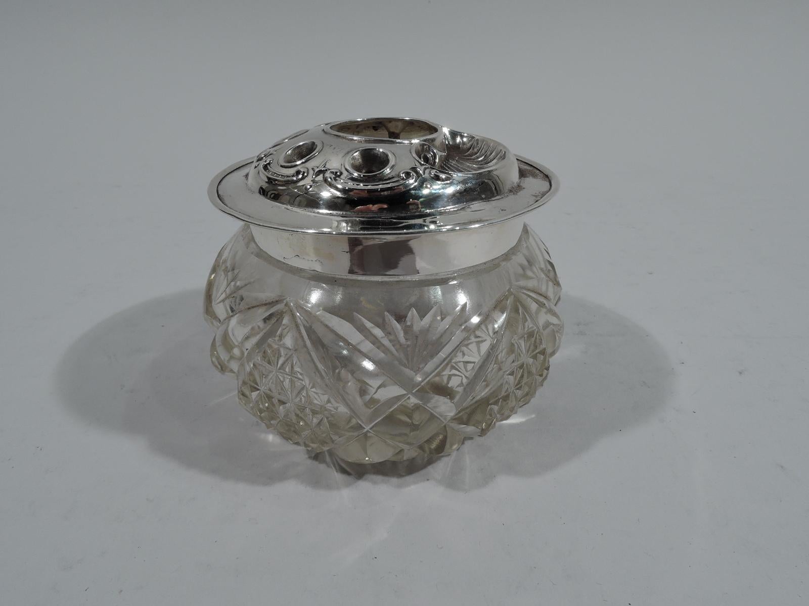 Edwardian glass jar with sterling silver cover. Made by Arthur Wilmore Pennington in Birmingham in 1908. Jar round and curved with short straight neck. Cut ferns, diaper, and stars. Cover has central hair receiver hole and small pin holes. Shell and