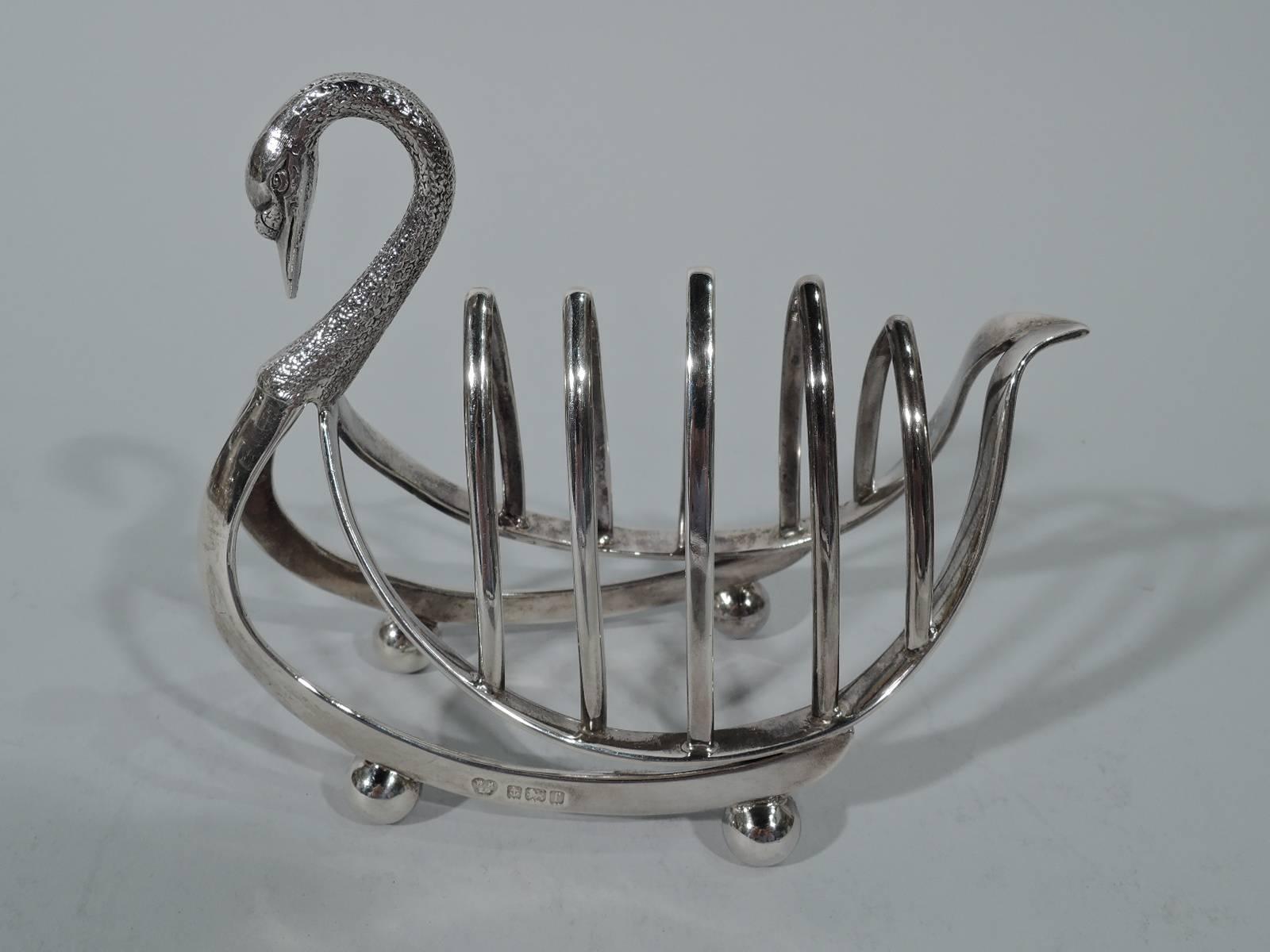 Edwardian sterling silver toast rack. Made by Williams Birmingham Ltd in Birmingham in 1905. Swan-form with five arched partitions in boat-form frame mounted to split and curved open body. Scrolled and stippled neck with pointed bill and beady eyes.