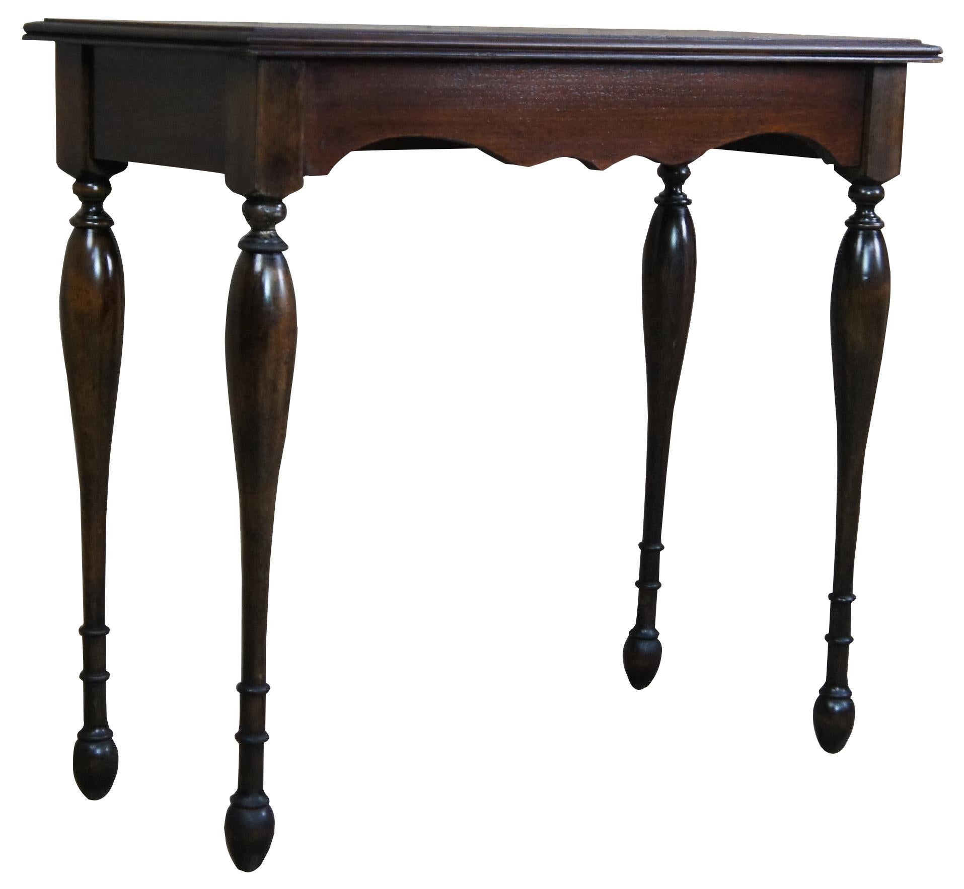 Early 20th century Walnut hall table. A rectangular form with serpentine cut apron over pin shaped ribbed legs leading to bun feet. Measures: 30