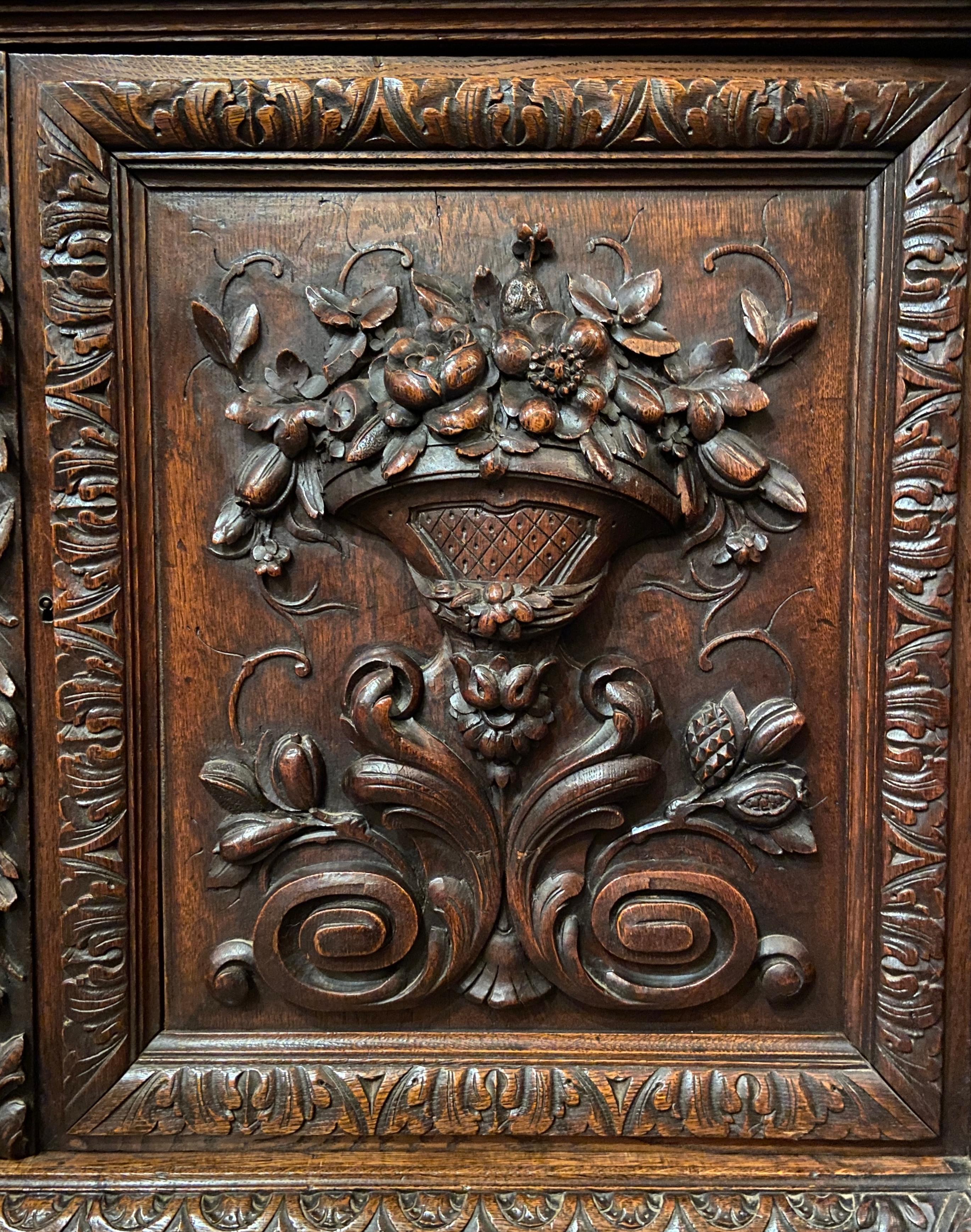 19th Century Antique English Elizabethan Carved Oak Cabinet with Lead Glass Doors, Circa 1860
