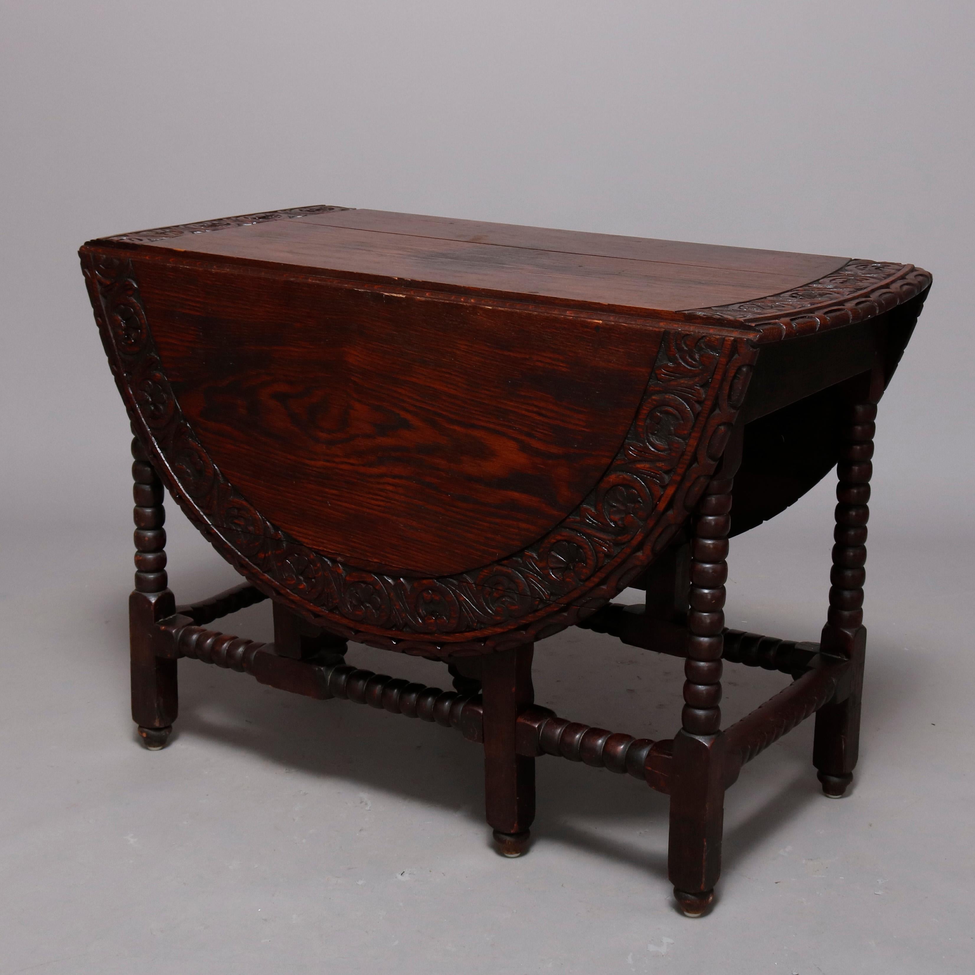 Hand-Carved Antique English Elizabethan Carved Oak Drop Leaf Dining Table, circa 1860