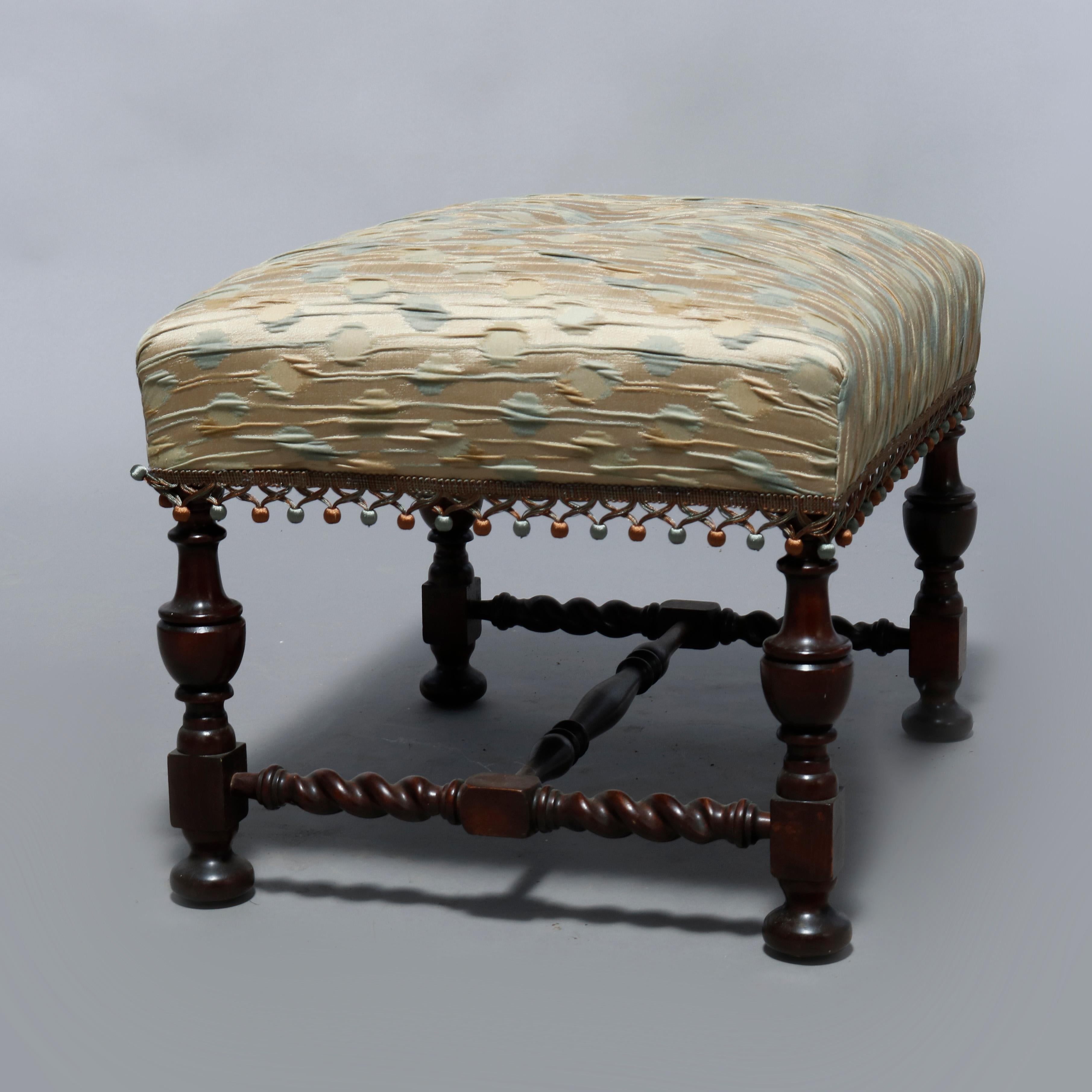 An antique English Elizabethan style bench offers single button upholstered seat on carved mahogany frame having turned legs and barley twist stretcher, 20th century

Measures: 18.5