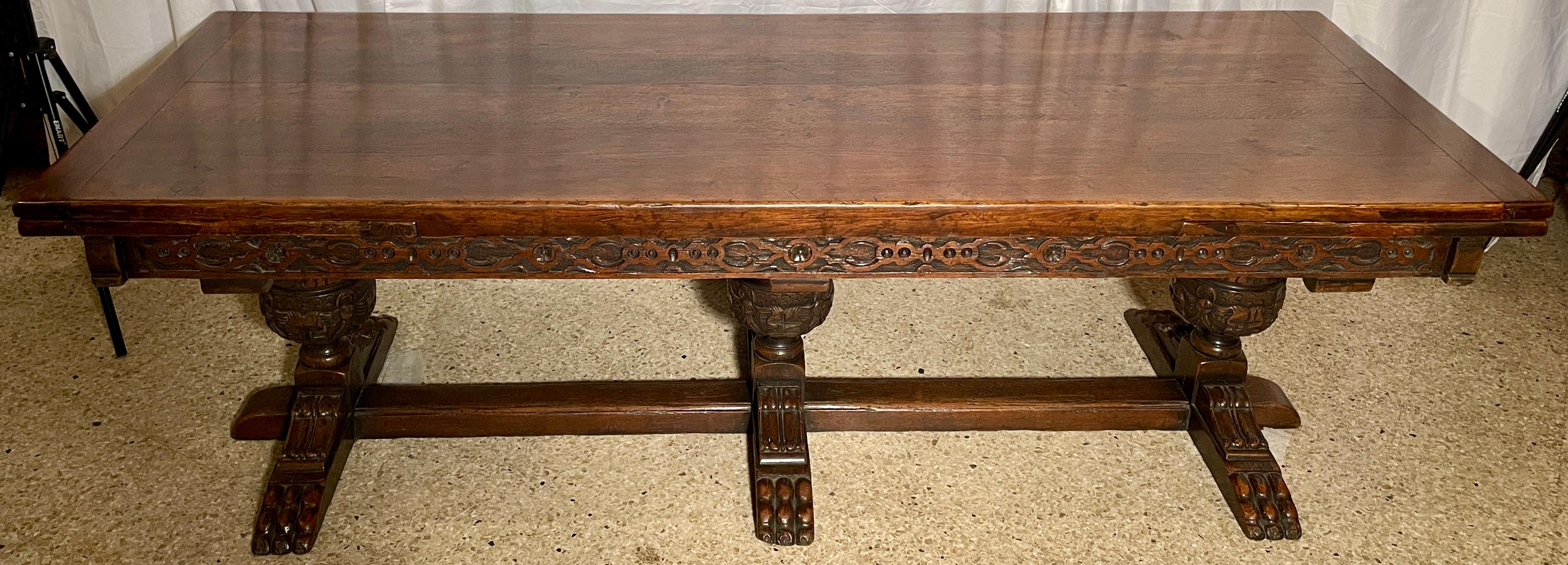Antique English Elizabethan style extension trestle table, over 100 years old.
 
