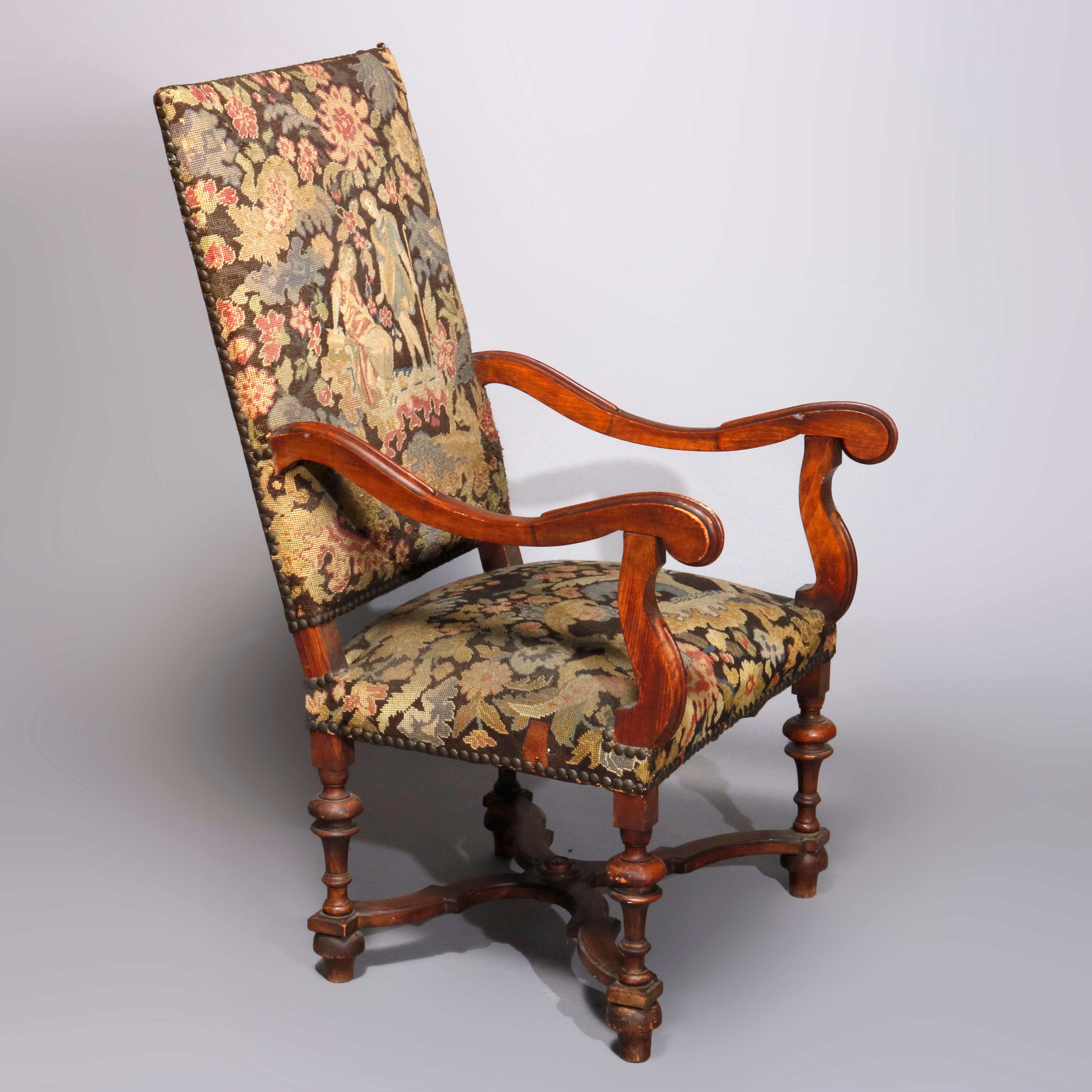 An antique English Elizabethan style tall throne armchair offers carved walnut frame with tapestry upholstery having countryside courting scene, raised on turned legs with X-form stretcher, circa 1890.

Measures- 47
