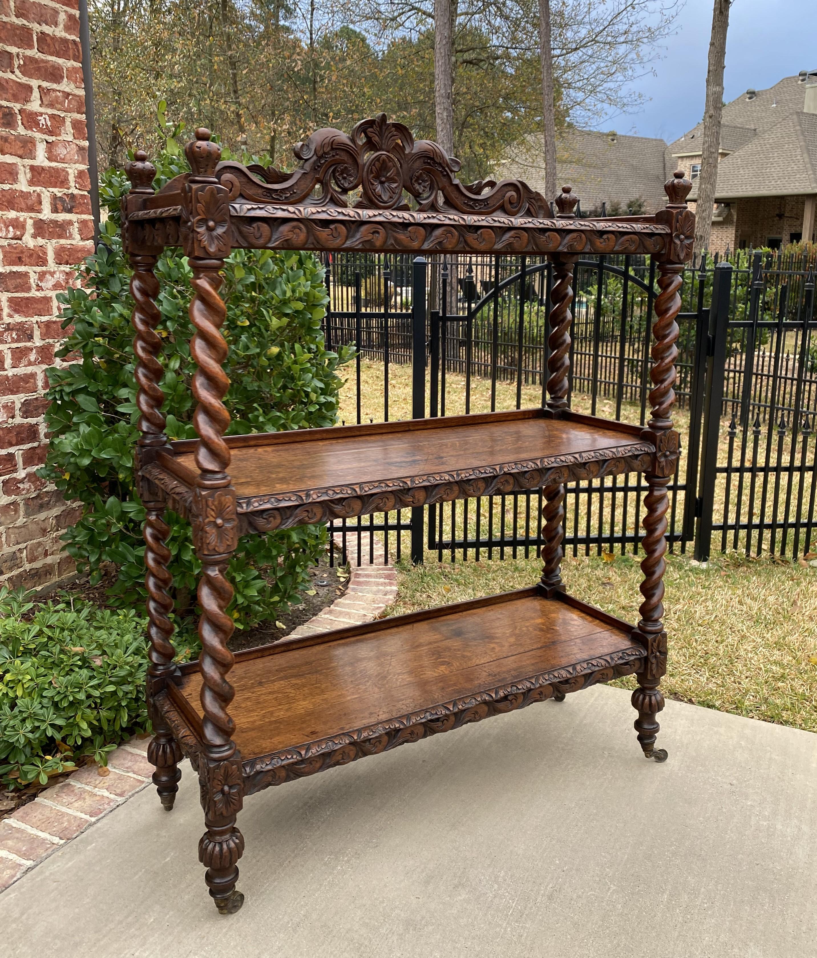 Superb and unique antique English oak etagere, server, display shelf or bookcase~~barley twist posts and casters~~~c. 1880s

This is only one of multiple exquisite pieces recently received from our English shipper~~19th century and in unbelievably