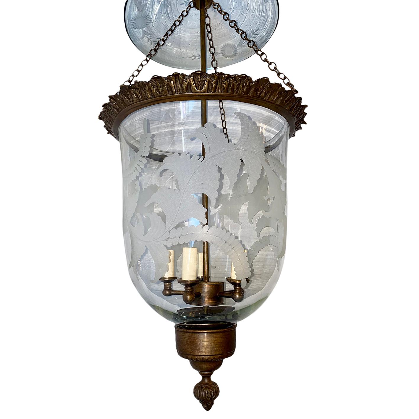 An antique circa 1920s English etched glass lantern with patinated bronze fittings and five interior candelabra lights.

Measurements:
Minimum drop 32